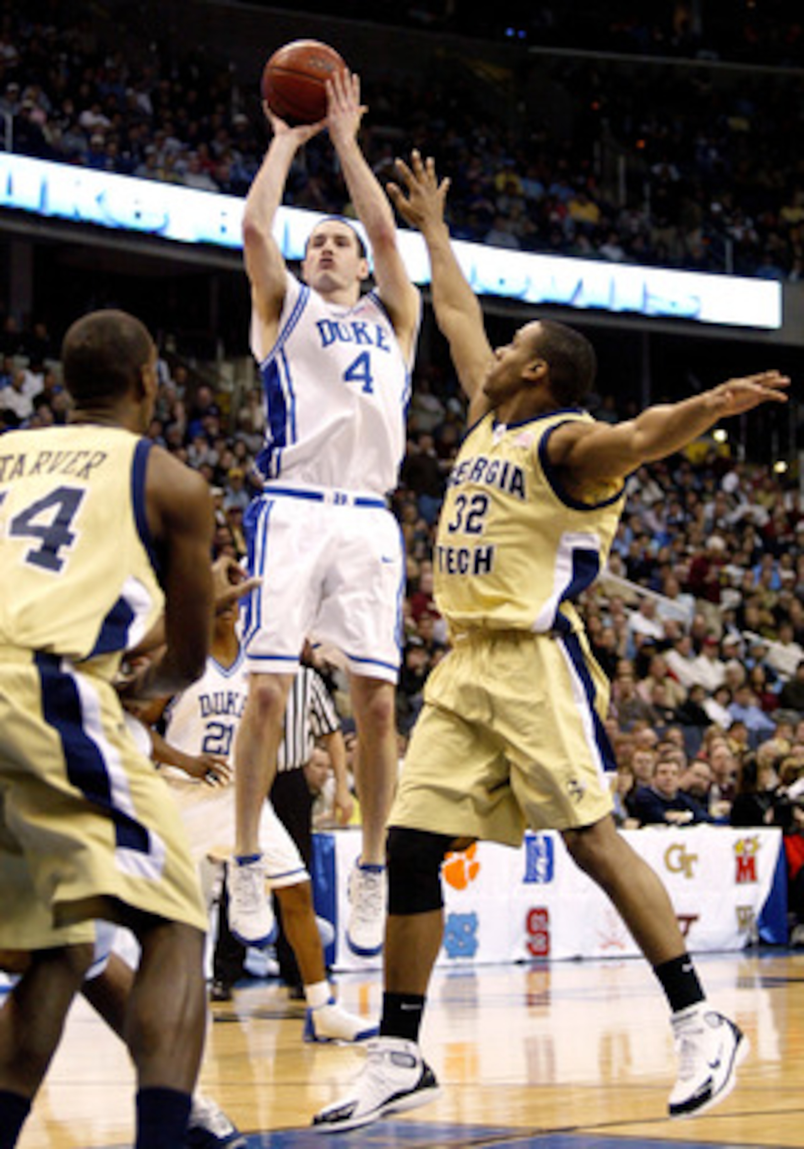WASHINGTON - MARCH 13:  J.J. Redick #4 of the Duke Blue Devils puts up a jump shot over Jeremis Smith #32 of the Georgia Tech Yellow Jackets during the ACC Tournament Championship Game against the Georgia Tech Yellow Jackets on March 13, 2005 at the MCI C
