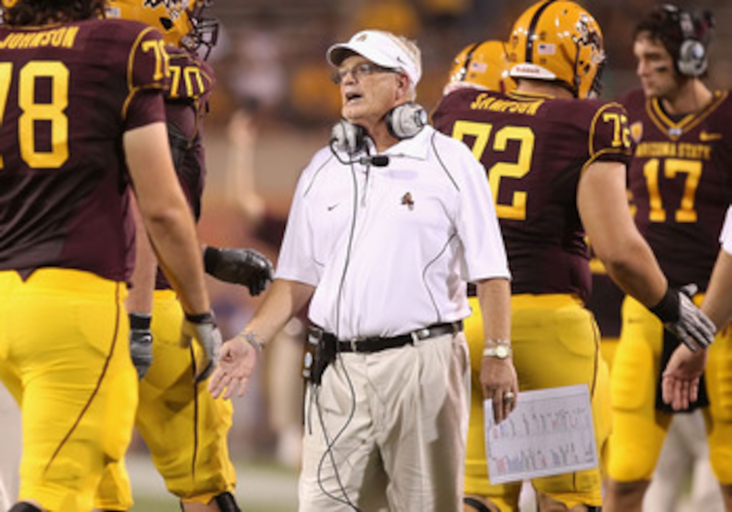 TEMPE, AZ - SEPTEMBER 04:  Head coach Dennis Erickson of the Arizona State Sun Devils congratulates teammates after the Sun Devils scored a touchdown during the college football game against the Portland State Vikings at Sun Devil Stadium on September 4,