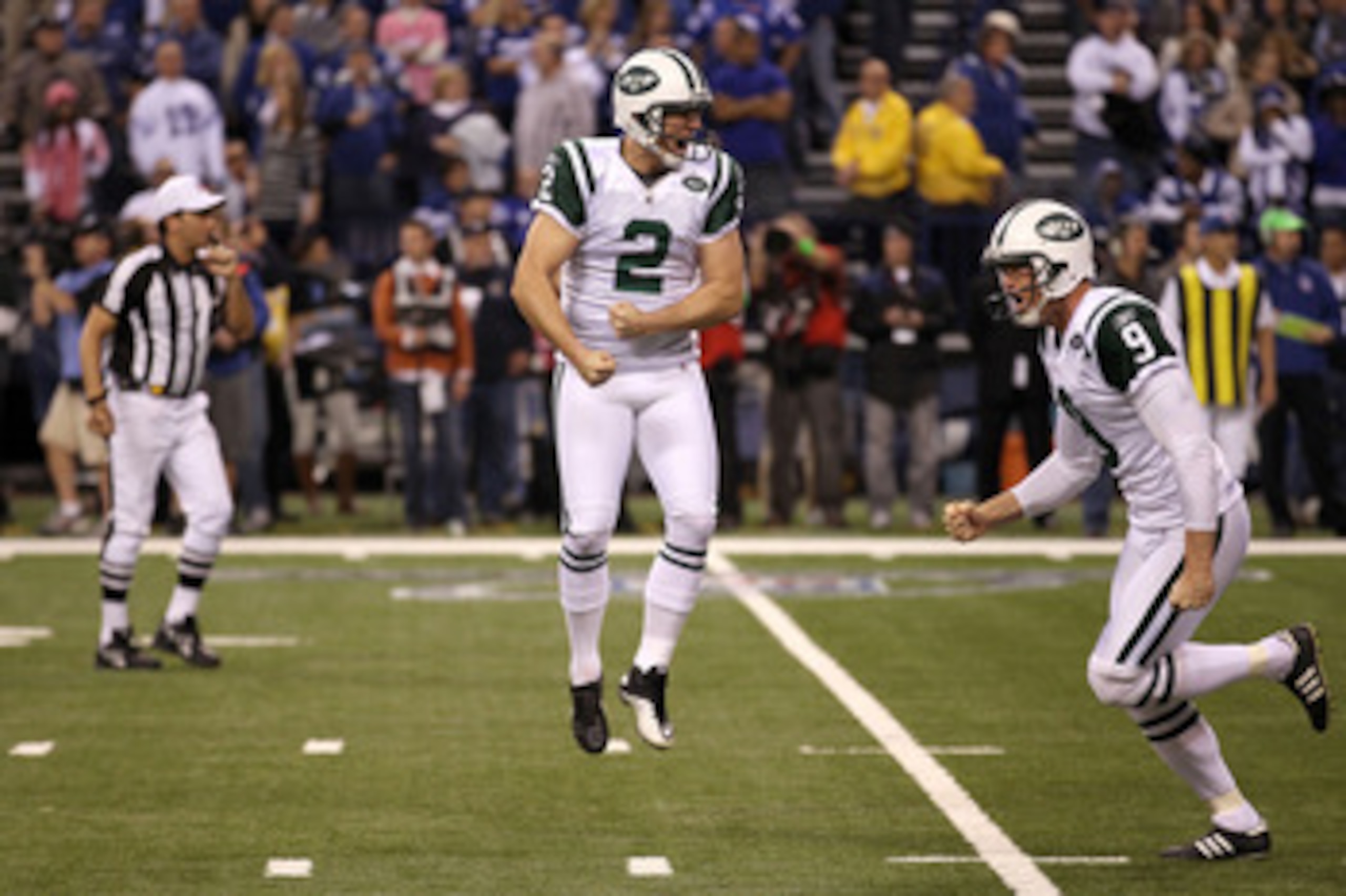INDIANAPOLIS, IN - JANUARY 08:  Place kicker Nick Folk #2 and Steve Weatherford #9 of the New York Jets celebrates after Folk successfully kicked a game-winning a 32-yard field goal in the fourth quarter to win 17-16 against the Indianapolis Colts during 