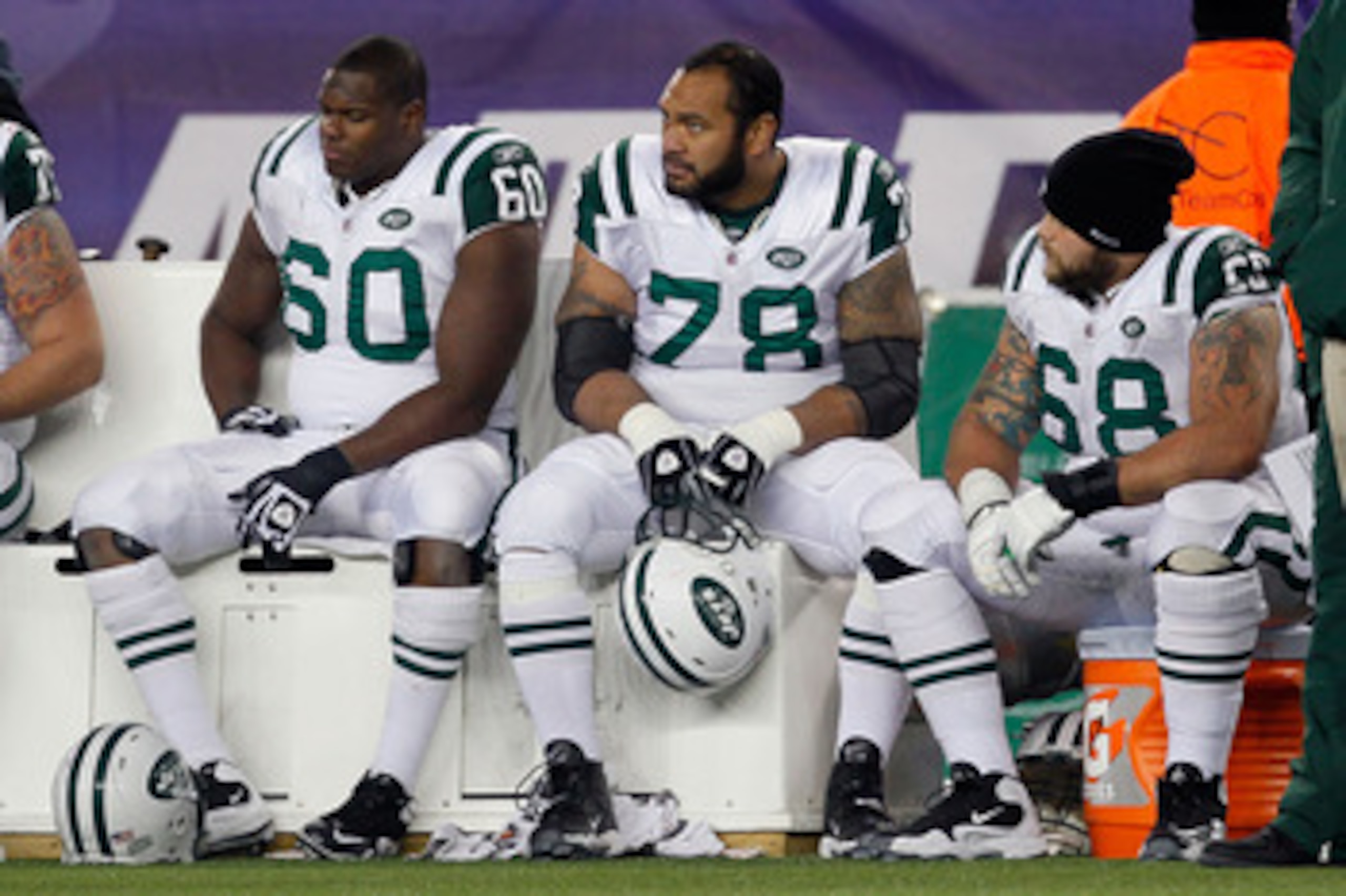 FOXBORO, MA - DECEMBER 06:  (L-R) D'Brickashaw Ferguson #60, Wayne Hunter #78 and Matt Slauson #68 of the New York Jets look on dejceted late in the fourth quarter against the New England Patriots at Gillette Stadium on December 6, 2010 in Foxboro, Massac