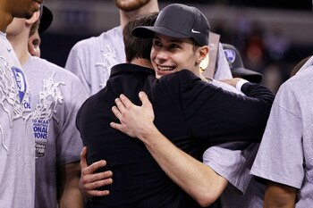 INDIANAPOLIS - APRIL 05:  Head coach Mike Krzyzewski and Jon Scheyer (R) of the Duke Blue Devils celebrate after they won 61-59 against the Butler Bulldogs during the 2010 NCAA Division I Men's Basketball National Championship game at Lucas Oil Stadium on