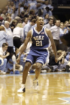 CHAPEL HILL, NC - FEBRUARY 5: Chris Duhon #21 of the Duke Blue Devils celebrates after beating the University of North Carolina Tar Heels with his final shot on February 5, 2004 at the Dean E. Smith Center in Chapel Hill, North Carolina.  (Photo by Street