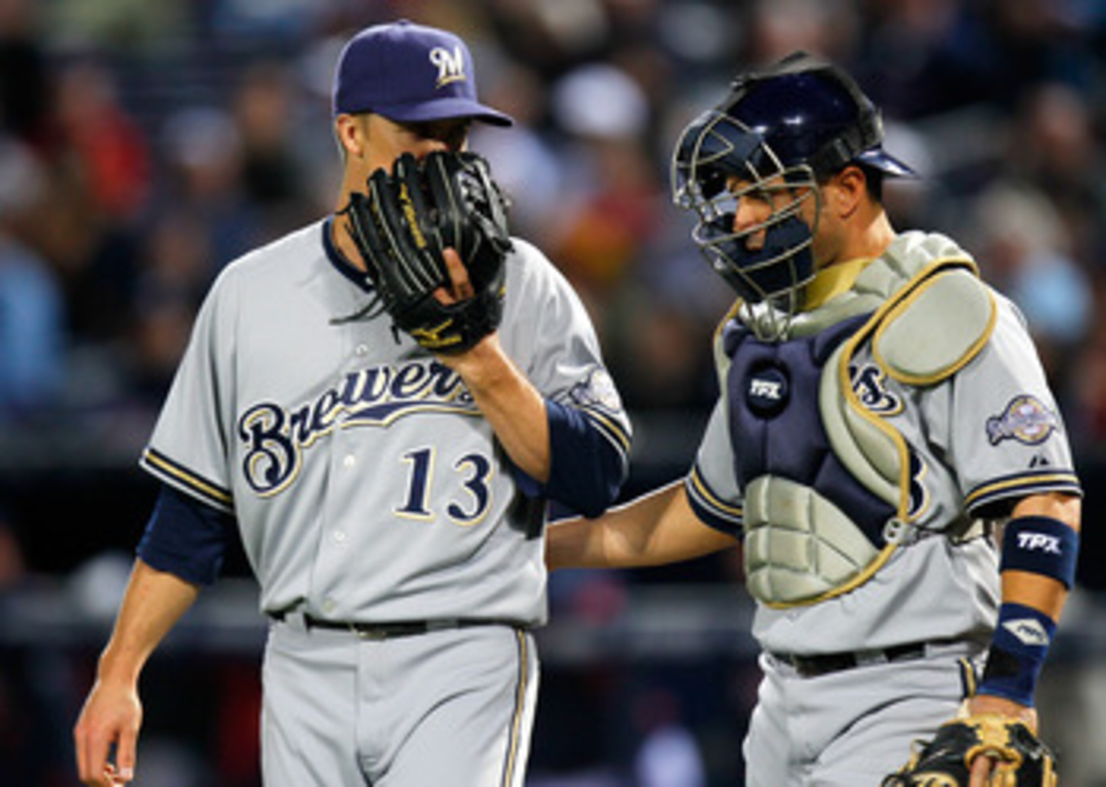 ATLANTA, GA - MAY 04: Zack Greinke #13 of the Milwaukee Brewers converses with catcher Wil Nieves #33 against the Atlanta Braves at Turner Field on May 4, 2011 in Atlanta, Georgia. (Photo by Kevin C. Cox/Getty Images) ATLANTA, GA - MAY 04: Zack Greinke #13 of the Milwaukee Brewers converses with catcher Wil Nieves #33 against the Atlanta Braves at Turner Field on May 4, 2011 in Atlanta, Georgia. (Photo by Kevin C. Cox/Getty Images)