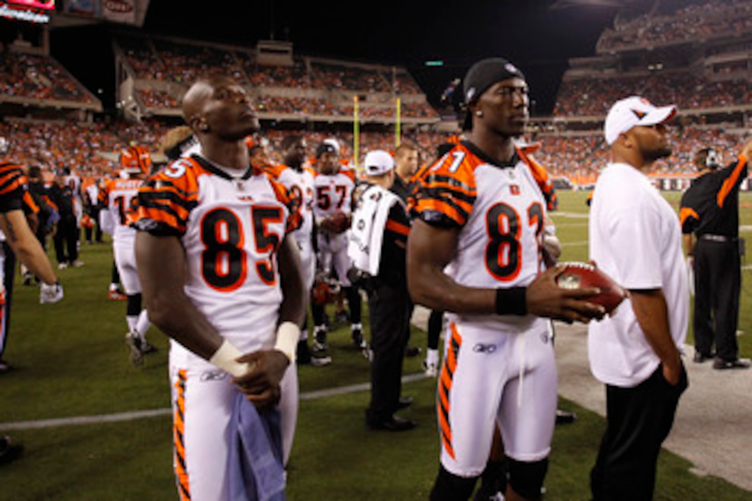 CINCINNATI, OH - AUGUST 15: Terrell Owens #81 and Chad Ochocinco #85 of the Cincinnati Bengals look on during the preseason game against the Denver Broncos at Paul Brown Stadium on August 15, 2010 in Cincinnati, Ohio. The Bengals won 33-24. (Photo by Joe