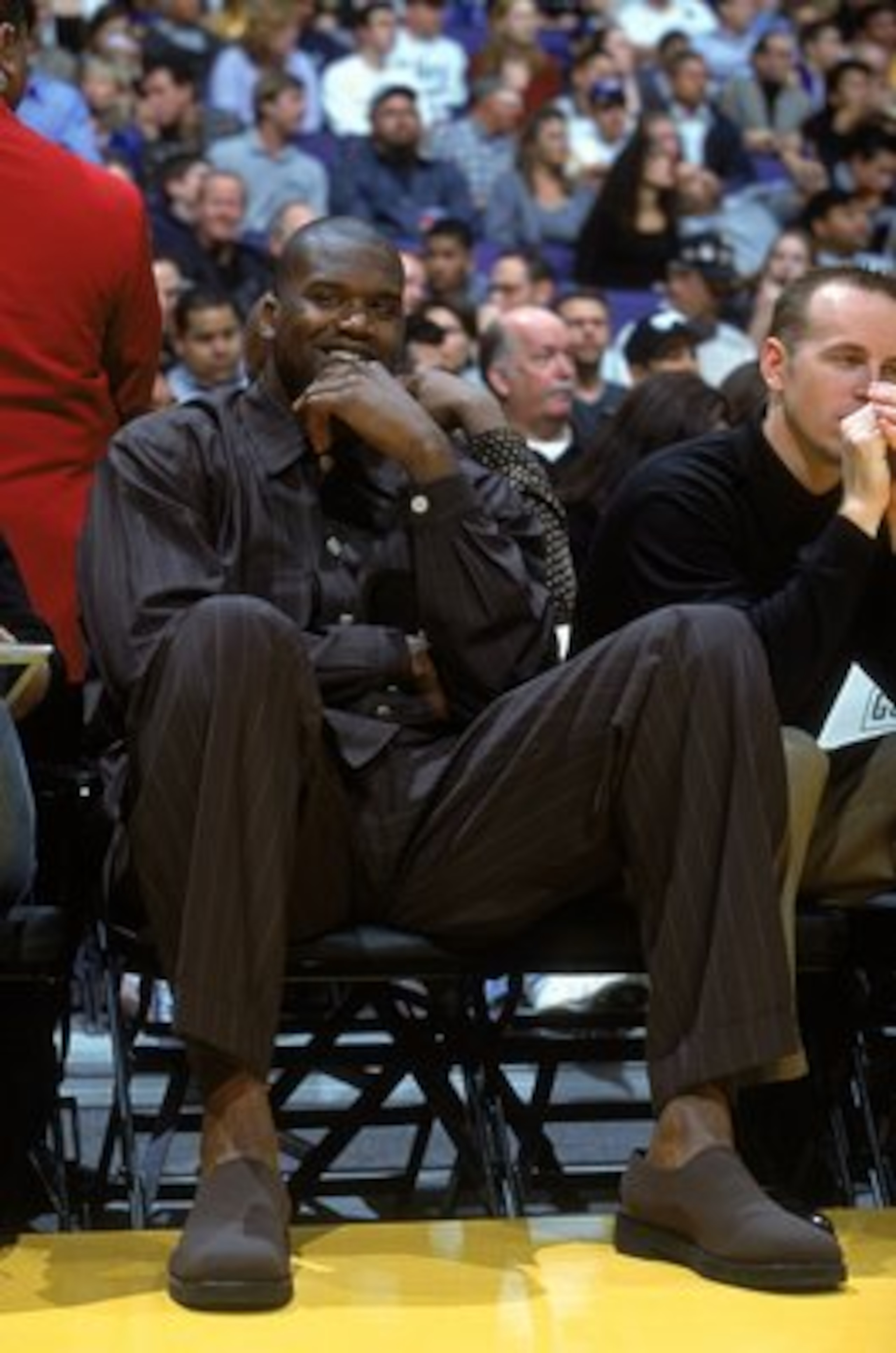 2 Feb 2001:  Shaquille O''Neal #34 of the Los Angeles Lakers sits and watches the action while resting after an injury during the game against the Charlotte Hornets at the STAPLES Center in Los Angeles, California. The Lakers defeated the Hornets 93-87.  