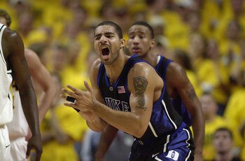 CHICAGO - NOVEMBER 27: Carlos Boozer #4 of the Duke Blue Devils celebrates during the ACC/Big Ten Challenge against the Iowa Hawkeyes at United Center in Chicago, Illinois on November 27, 2001. The Blue Devils won 80-62.   (Photo by Jonathan Daniel/Getty