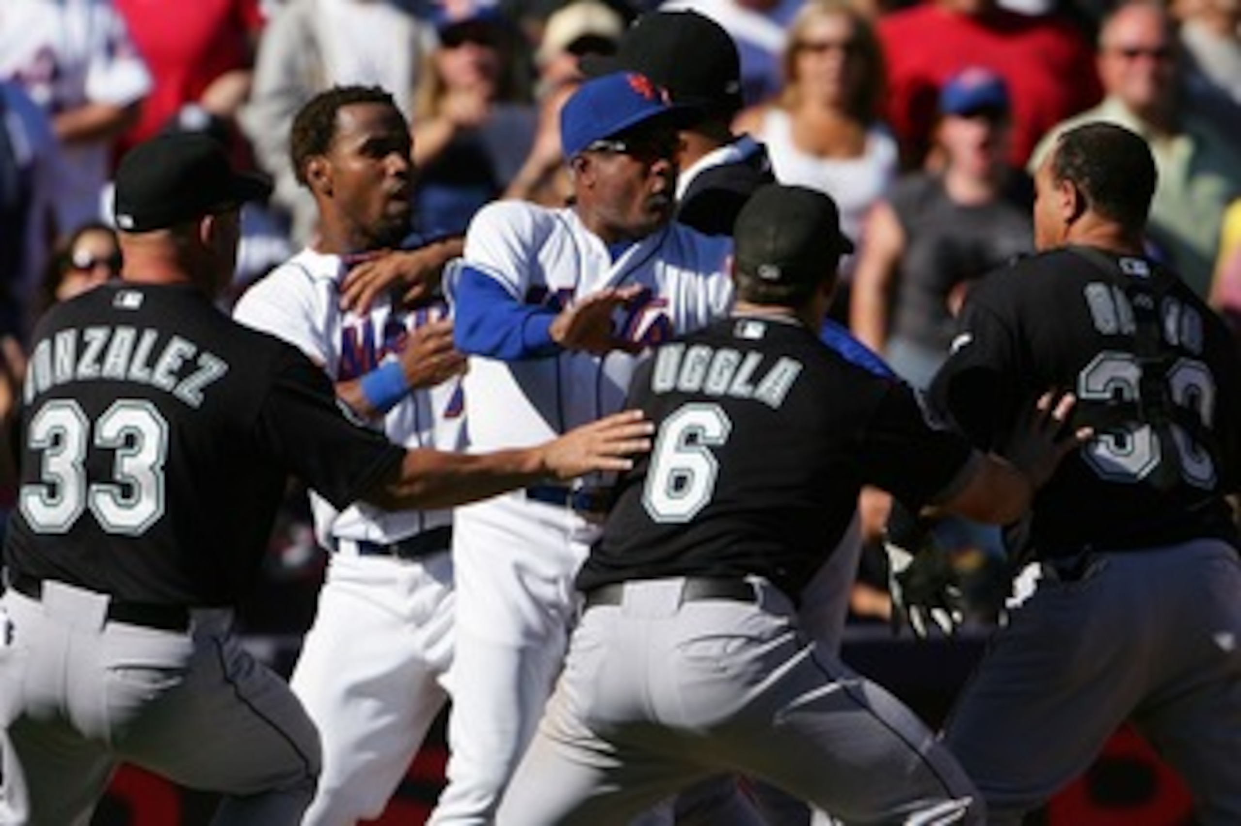 NEW YORK - SEPTEMBER 29:  Miguel Cabrera #24 of the Florida Marlins holds back Jose Reyes #7 of the New York Mets as New York Mets third base coach Sandy Alomar #28 holds back Marlins players Fredi Gonzalez #33, Dan Uggla #6 and Miguel Olivo #30 after a f