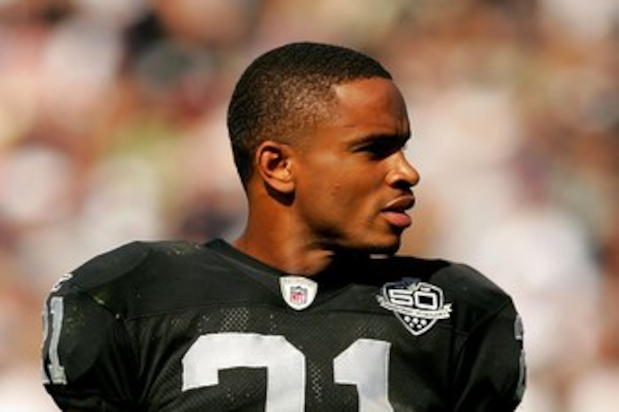 OAKLAND, CA - SEPTEMBER 27: Nnamdi Asomugha #21 takes off his helmet during a break in play in their game against the Denver Broncos at the Oakland-Alameda County Coliseum on September 27, 2009 in Oakland, California. (Photo by Ezra Shaw/Getty Images) OAKLAND, CA - SEPTEMBER 27: Nnamdi Asomugha #21 takes off his helmet during a break in play in their game against the Denver Broncos at the Oakland-Alameda County Coliseum on September 27, 2009 in Oakland, California. (Photo by Ezra Shaw/Getty Images)