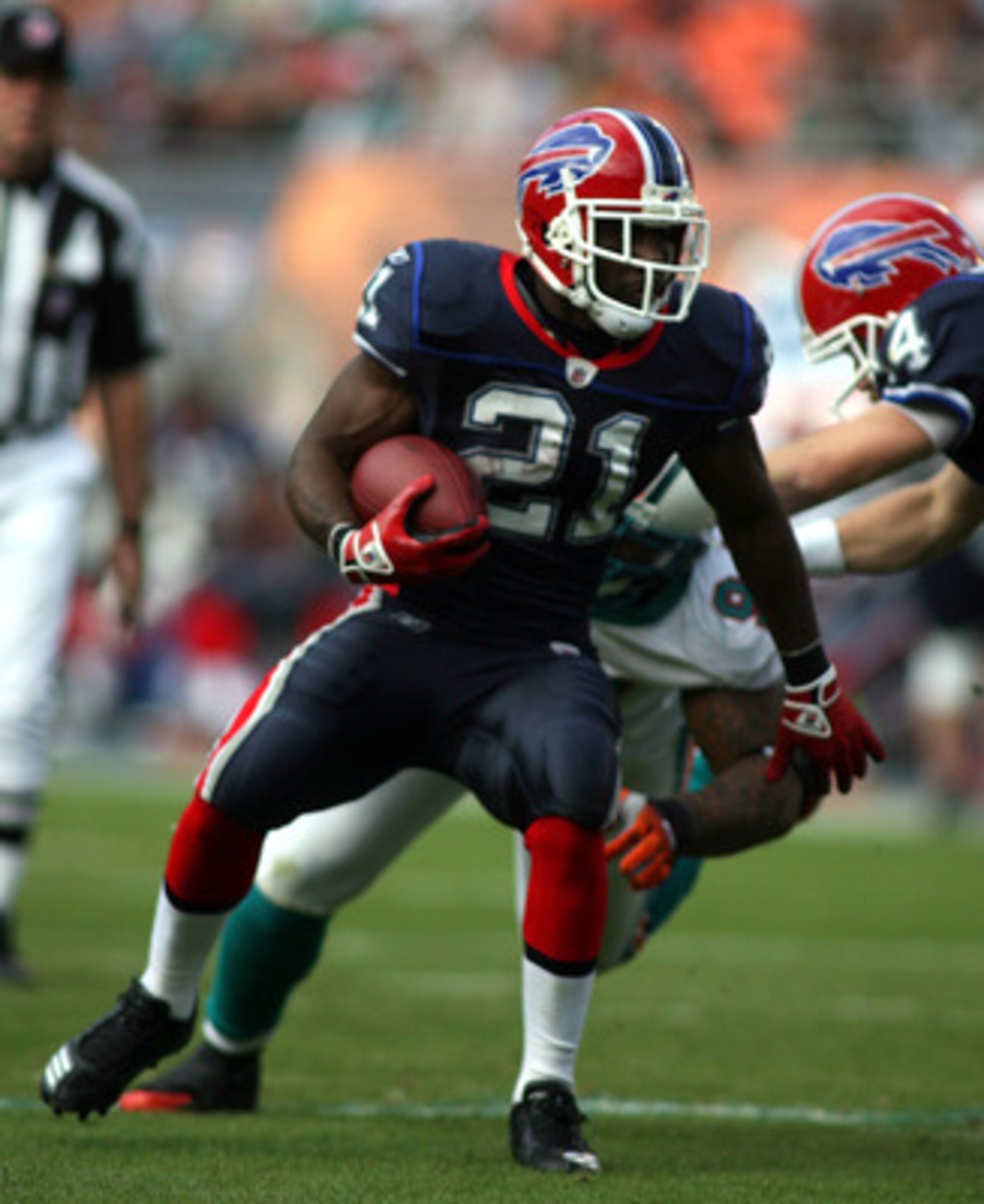 MIAMI - DECEMBER 19:  Running Back C.J. Spiller #21 of the Buffalo Bills runs against the Miami Dolphins at Sun Life Stadium on December 19, 2010 in Miami, Florida.The Bills defeated the Dolphins 17-14.  (Photo by Marc Serota/Getty Images)