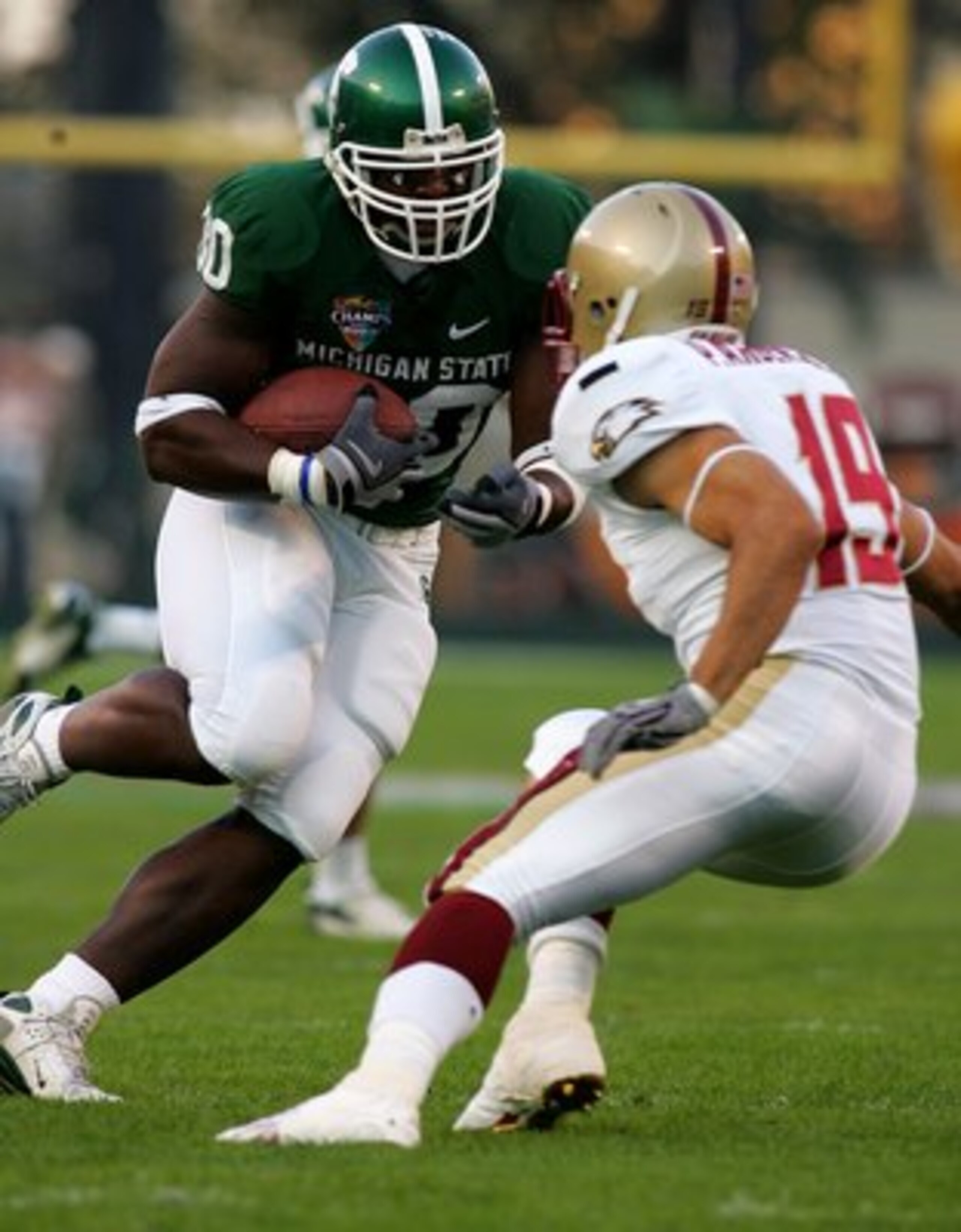 ORLANDO, FL - DECEMBER 28:  Jehuu Caulcrick #30 of the Michigan Sate Spartans is chased down by Paul Anderson #19 of the Boston College Eagles during the Champs Bowl on December 28, 2007 at the Citrus Bowl in Orlando, Florida.  (Photo by Sam Greenwood/Get
