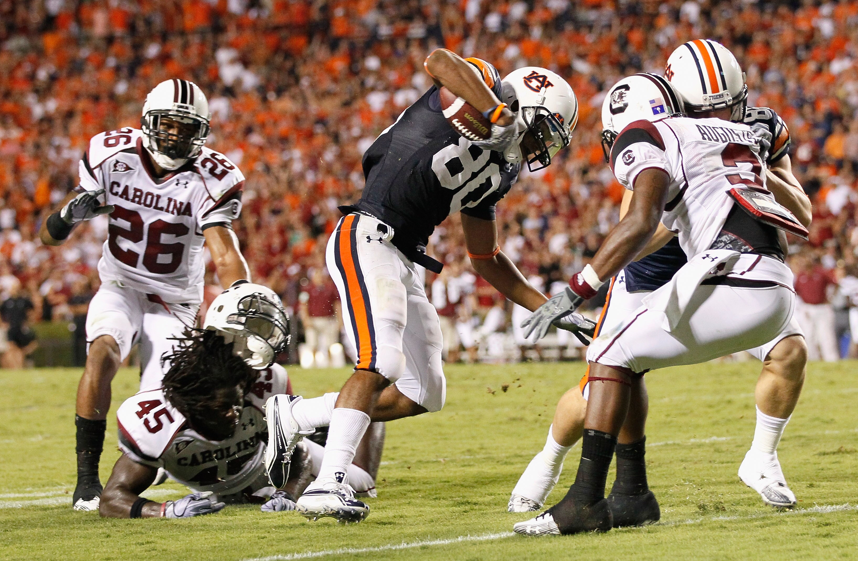 AUBURN, AL - SEPTEMBER 25:  Emory Blake #80 of the Auburn Tigers breaks a tackle by Rodney Paulk #45 of the South Carolina Gamecocks on the way to a touchdown at Jordan-Hare Stadium on September 25, 2010 in Auburn, Alabama.  (Photo by Kevin C. Cox/Getty I