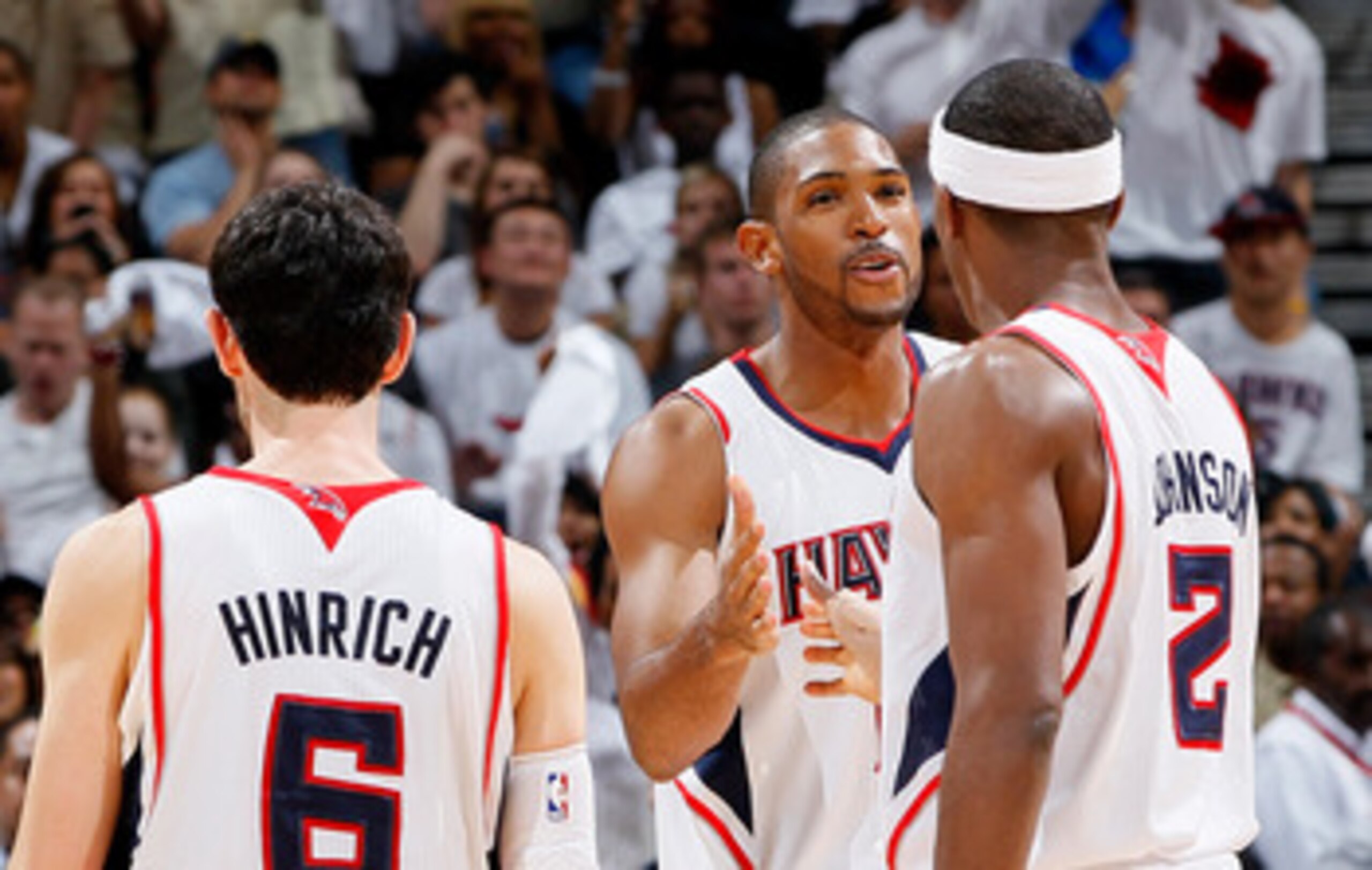 ATLANTA, GA - APRIL 24:  Al Horford #15 of the Atlanta Hawks celebrates after a basket against the Orlando Magic with Kirk Hinrich #6 and Joe Johnson #2 during Game Four of the Eastern Conference Quarterfinals in the 2011 NBA Playoffs at Philips Arena on