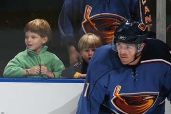 ATLANTA, GA - SEPTEMBER 29:  Young fans watch warm-ups behind J. P. Vigier #11 of the Atlanta Thrashers before the game against the Nashville Predators on September 29, 2006 at Philips Arena in Atlanta, Georgia. (Photo by Scott Cunningham/Getty Images)