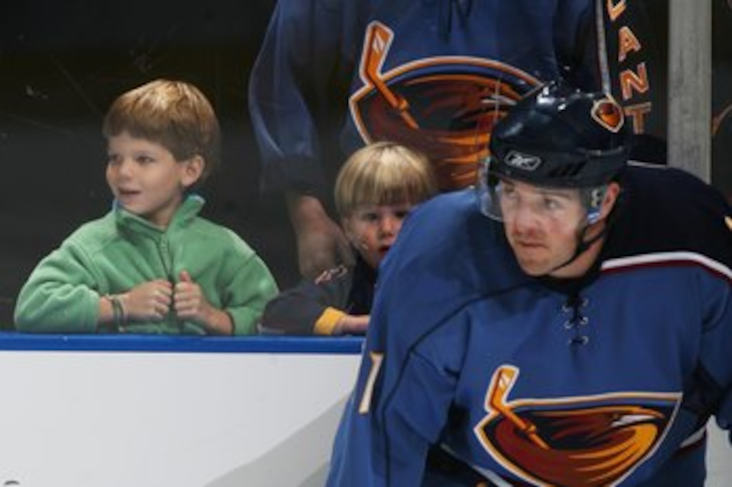 ATLANTA, GA - SEPTEMBER 29:  Young fans watch warm-ups behind J. P. Vigier #11 of the Atlanta Thrashers before the game against the Nashville Predators on September 29, 2006 at Philips Arena in Atlanta, Georgia. (Photo by Scott Cunningham/Getty Images)