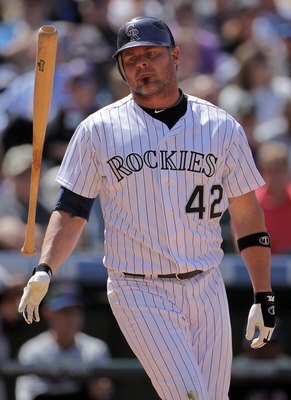 DENVER - APRIL 15:  First baseman Jason Giambi #42 of the Colorado Rockies flips his bat after striking out against Mike Pelfrey of the New York Mets at Coors Field on April 15, 2010 in Denver, Colorado. All the players in MLB wore #42 today in honor of J