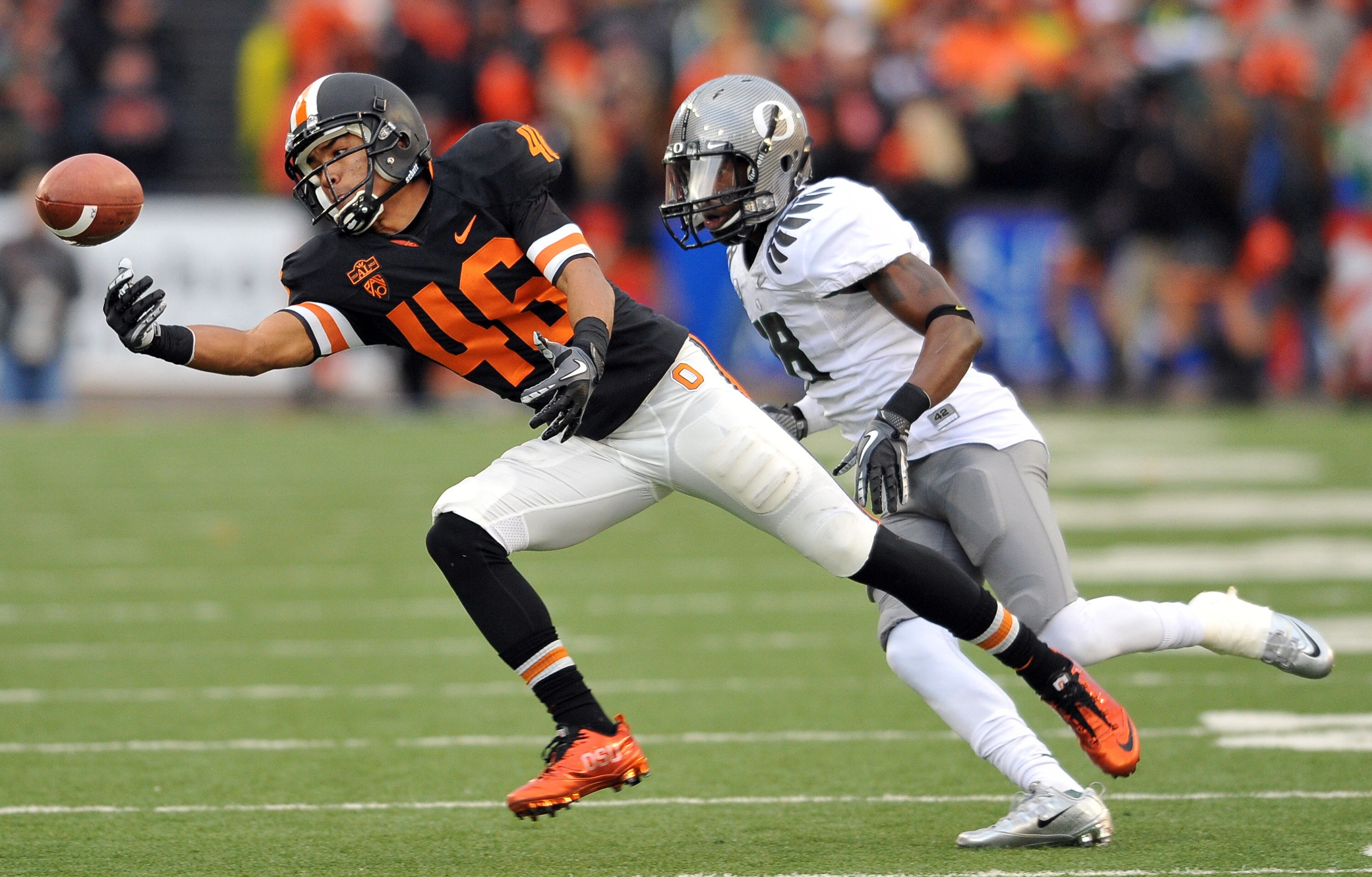 CORVALLIS, OR - DECEMBER 4: Aaron Nichols #46 of the Oregon State Beavers can't control the pass intended for him as Anthony Gildon #18 of the Oregon Ducks closes in during the fourth quarter of the game at Reser Stadium on December 4, 2010 in Corvallis,