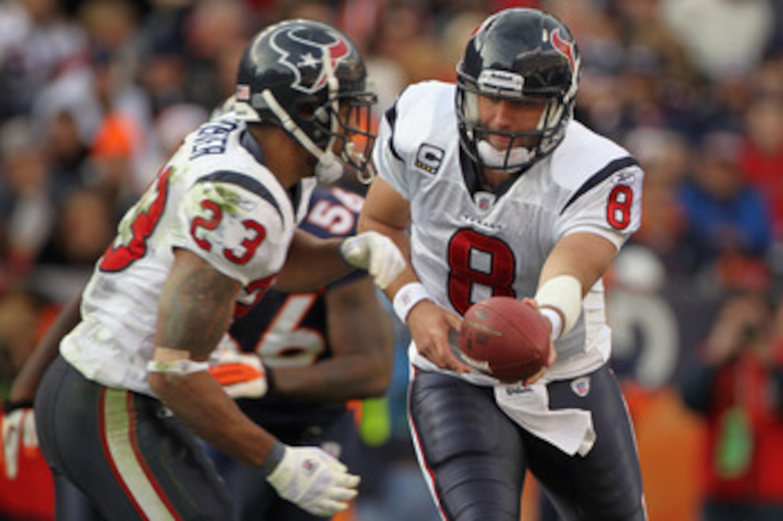 DENVER - DECEMBER 26:  Quarterback Matt Schaub #8 of the Houston Texas hands the ball off to running back Renaldo Hill #23 of the Texans against the Denver Broncos at INVESCO Field at Mile High on December 26, 2010 in Denver, Colorado.  (Photo by Doug Pen