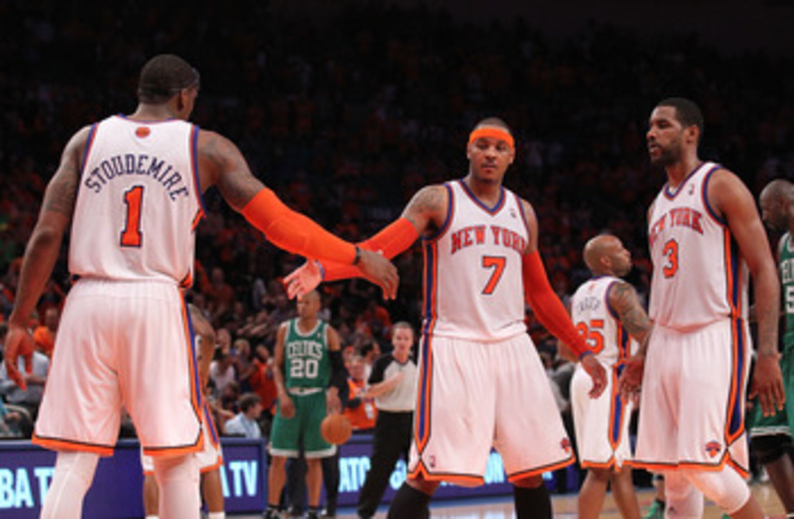 NEW YORK, NY - APRIL 24:  (L-R) Amar'e Stoudemire #1, Carmelo Anthony #7 and Shawne Williams #3 of the New York Knicks celebrate a play against the Boston Celtics in Game Four of the Eastern Conference Quarterfinals during the 2011 NBA Playoffs on April 2