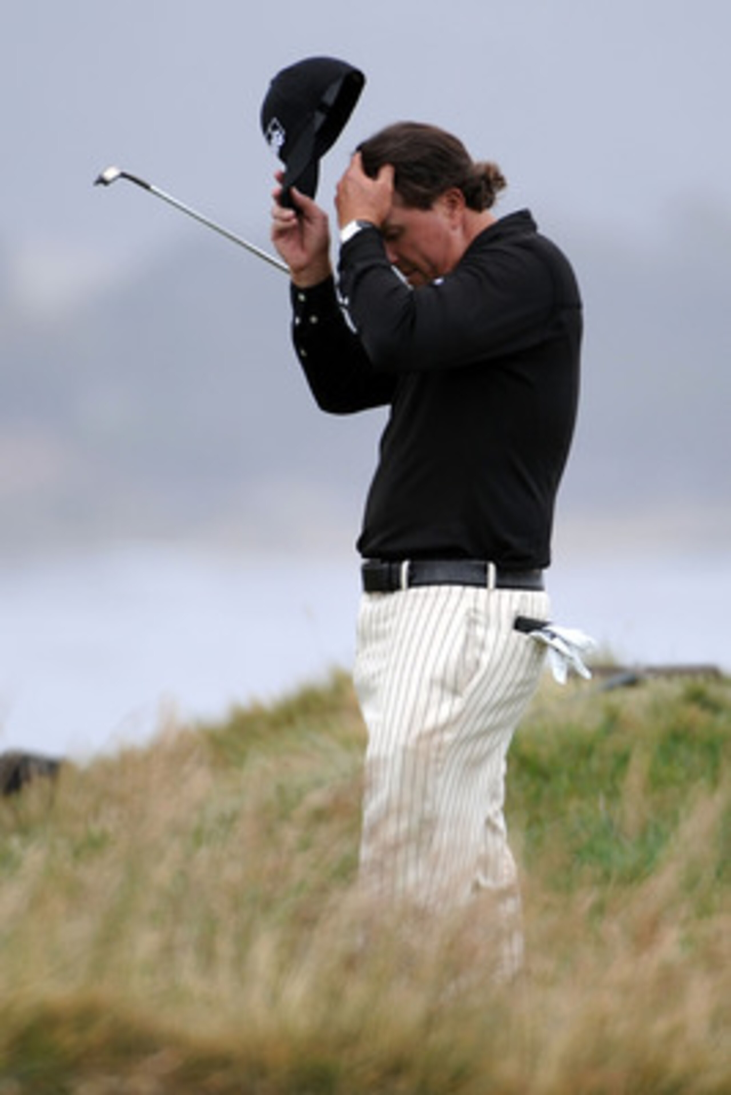 PEBBLE BEACH, CA - JUNE 20:  Phil Mickelson waits on the 17th green during the final round of the 110th U.S. Open at Pebble Beach Golf Links on June 20, 2010 in Pebble Beach, California.  (Photo by Harry How/Getty Images)