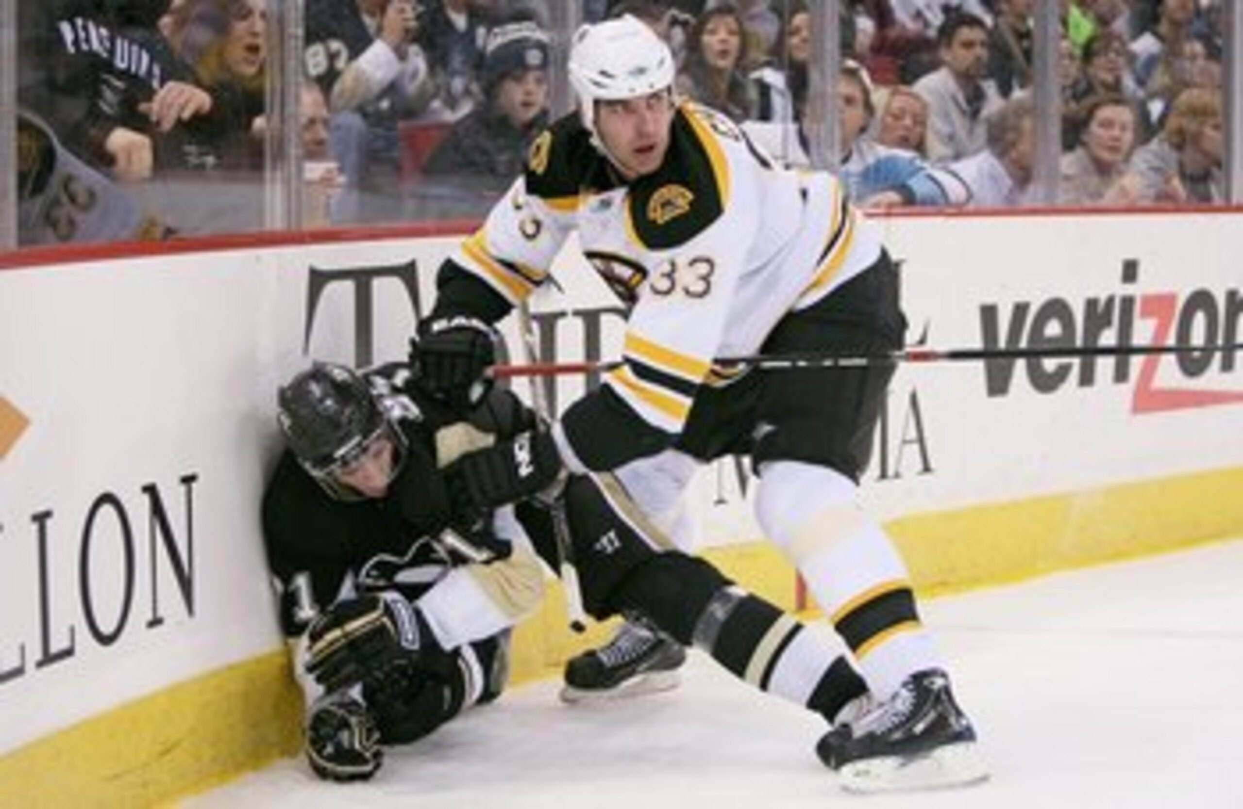 PITTSBURGH - DECEMBER 30: Defenseman Zdeno Chara #33 of the Boston Bruins checks forward Evgeni Malkin #71 of the Pittsburgh Penguins on December 30, 2008 at Mellon Arena in Pittsburgh, Pennsylvania.  (Photo by Jamie Sabau/Getty Images)