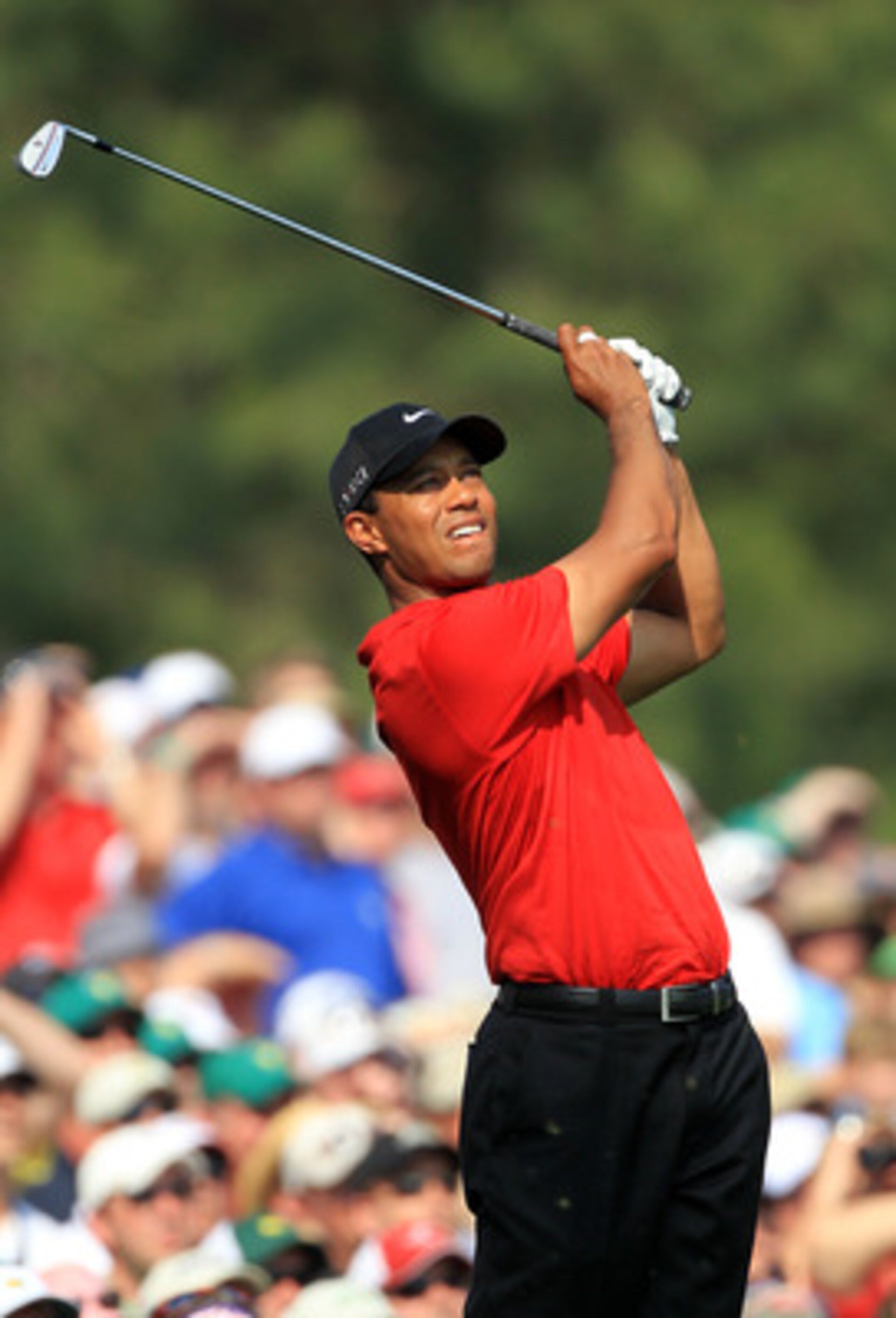 AUGUSTA, GA - APRIL 10:  Tiger Woods hits his tee shot on the 12th hole during the final round of the 2011 Masters Tournament at Augusta National Golf Club on April 10, 2011 in Augusta, Georgia.  (Photo by David Cannon/Getty Images)