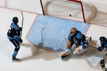 SUNRISE, FL - APRIL 2: Keaton Ellerby #4 of the Florida Panthers watches as the puck shot by Zbynek Michalek #4 (not pictured) of the Pittsburgh Penguins scores the winning goal past goaltender Scott Clemmensen #30 on April 2, 2011 at the BankAtlantic Cen