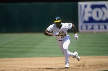 OAKLAND, CA - JUNE 13:  Rickey Henderson #24 of the Oakland Athletics runs the bases during the game against the Seattle Mariners at Network Associates Coliseum on June 13, 1998 in Oakland, California. (Photo by Otto Greule Jr/Getty Images)