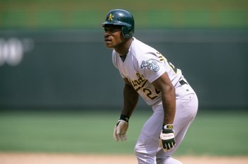 ARLINGTON, TX - JUNE 18:  Rickey Henderson #24 of the Oakland Athletics leads off during the game against the Texas Rangers at The Ballpark in Arlington on June 18, 1998 in Arlington, Texas. (Photo by Stephen Dunn/Getty Images)