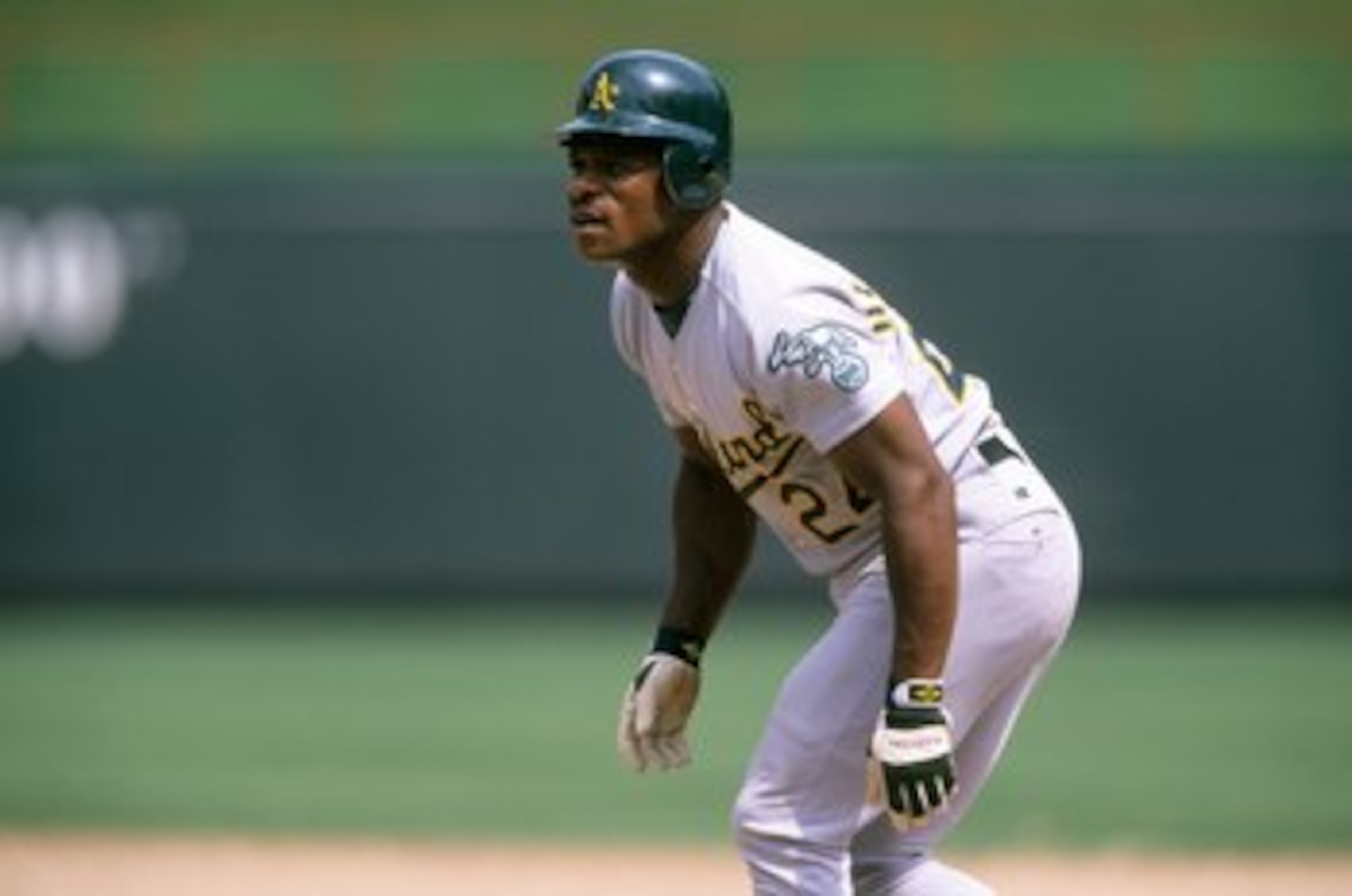 ARLINGTON, TX - JUNE 18: Rickey Henderson #24 of the Oakland Athletics leads off during the game against the Texas Rangers at The Ballpark in Arlington on June 18, 1998 in Arlington, Texas. (Photo by Stephen Dunn/Getty Images) ARLINGTON, TX - JUNE 18: Rickey Henderson #24 of the Oakland Athletics leads off during the game against the Texas Rangers at The Ballpark in Arlington on June 18, 1998 in Arlington, Texas. (Photo by Stephen Dunn/Getty Images)