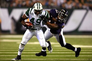 EAST RUTHERFORD, NJ - SEPTEMBER 13:  Tony Richardson #49 of the New York Jets stiff arms Ray Lewis #52 of the Baltimore Ravens during their home opener at the New Meadowlands Stadium on September 13, 2010 in East Rutherford, New Jersey.  (Photo by Andrew 
