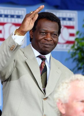 COOPERSTOWN, NY - JULY 26:  Hall of Famer Lou Brock waves to the crowd as he is introduced at Clark Sports Center during the 2009  Baseball Hall of Fame induction ceremony on July 26, 2009 in Cooperstown, New York.  (Photo by Jim McIsaac/Getty Images)