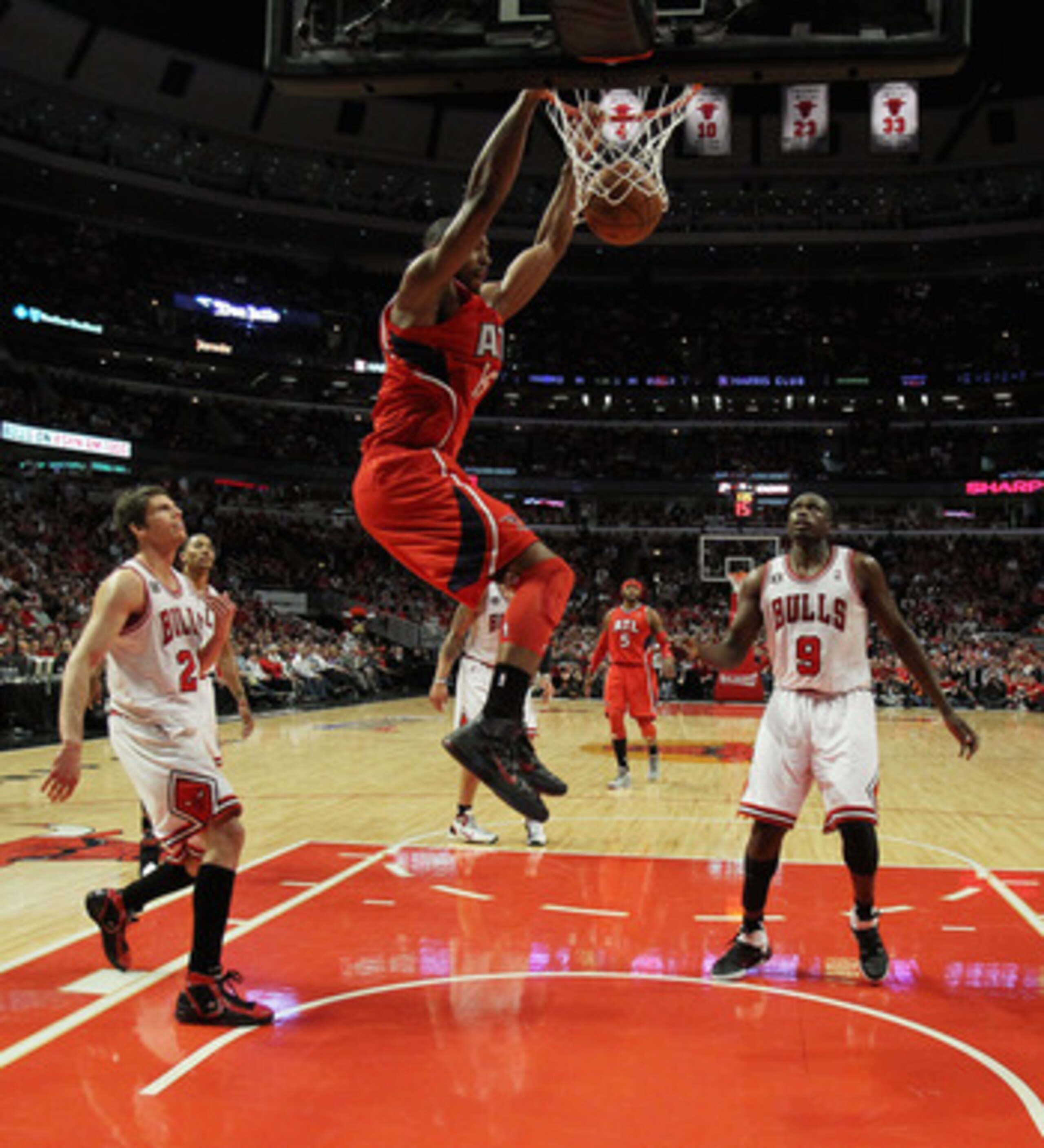 CHICAGO, IL - MAY 02: Al Horford #15 of the Atlanta Hawks dunks the ball over Kyle Korver #26 and Loul Deng #9 of the Chicago Bulls in Game One of the Eastern Conference Semifinals in the 2011 NBA Playoffs at the United Center on May 2, 2011 in Chicago, I