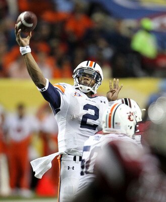 ATLANTA - DECEMBER 04:  Quarterback Cam Newton #2 of the Auburn Tigers passes the ball during the 2010 SEC Championship against the South Carolina Gamecocks at Georgia Dome on December 4, 2010 in Atlanta, Georgia.  (Photo by Mike Zarrilli/Getty Images)