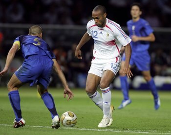 BERLIN - JULY 09:  Thierry Henry (R) of France is challenged by Fabio Cannavaro of Italy during the FIFA World Cup Germany 2006 Final match between Italy and France at the Olympic Stadium on July 9, 2006 in Berlin, Germany.
  (Photo by Ben Radford/Getty I