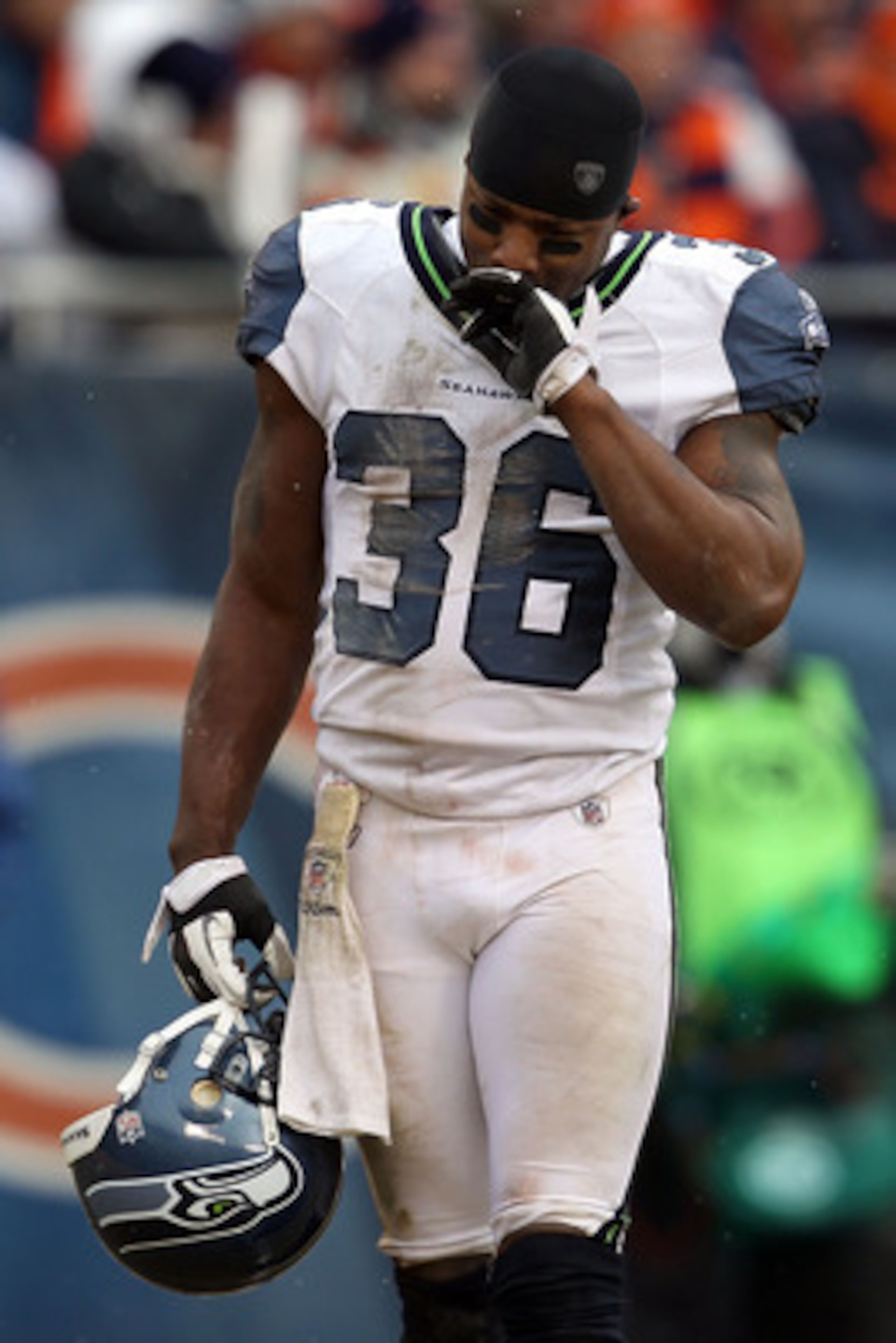 CHICAGO, IL - JANUARY 16:  Lawyer Milloy #36 of the Seattle Seahawks looks down as teammate Marcus Trufant #23 is injured on the field in the third quarter against the Chicago Bears in the 2011 NFC divisional playoff game at Soldier Field on January 16, 2