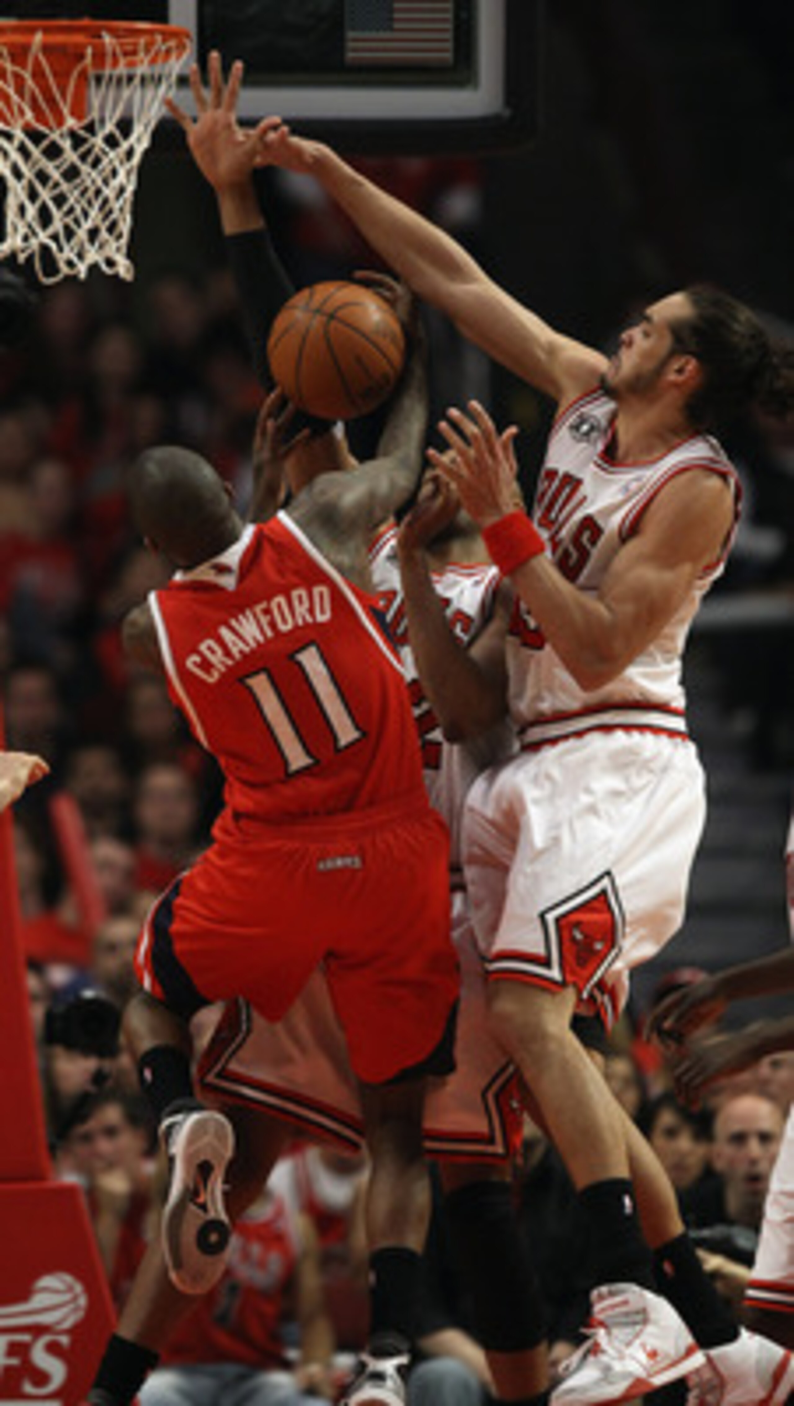CHICAGO, IL - MAY 02: Jamal Crawford #11 of the Atlanta Hawks is defended by Taj Gibson #22 and Joakim Noah #13 in Game One of the Eastern Conference Semifinals in the 2011 NBA Playoffs at the United Center on May 2, 2011 in Chicago, Illinois. The Hawks d