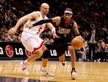 EAST RUTHERFORD, NJ - DECEMBER 10:  Allen Iverson #3 of the Philadelphia 76ers drives past Jason Kidd #5 of the New Jersey Nets during their game at Continental Airlines Arena on December 10, 2005 in East Rutherford, New Jersey.The Sixers defeated the Net