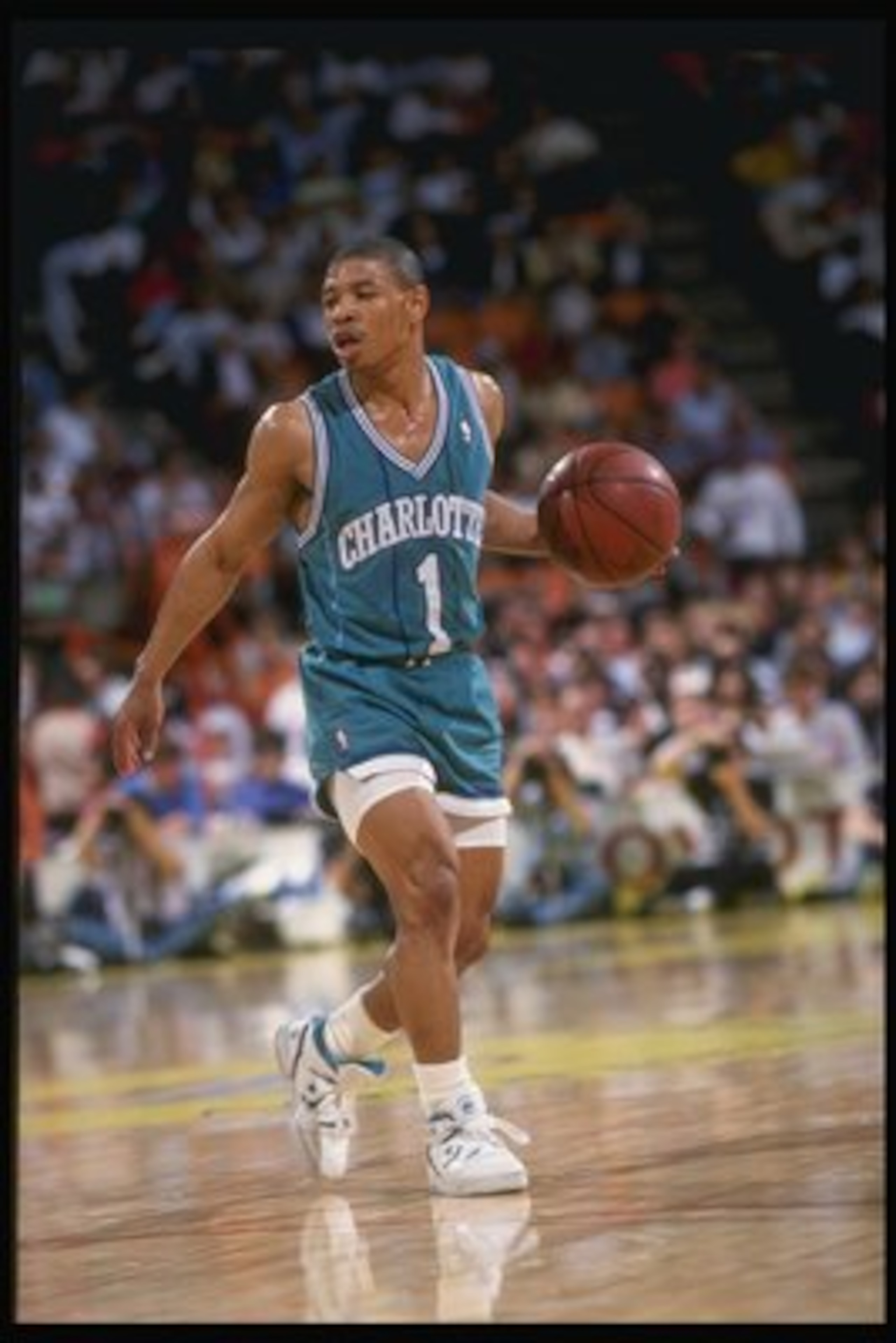 1989-1990: Guard Tyrone (Muggsy) Bogues of the Charlotte Hornets in action with the ball. Mandatory Credit: Stephen Dunn /Allsport 1989-1990: Guard Tyrone (Muggsy) Bogues of the Charlotte Hornets in action with the ball. Mandatory Credit: Stephen Dunn /Allsport