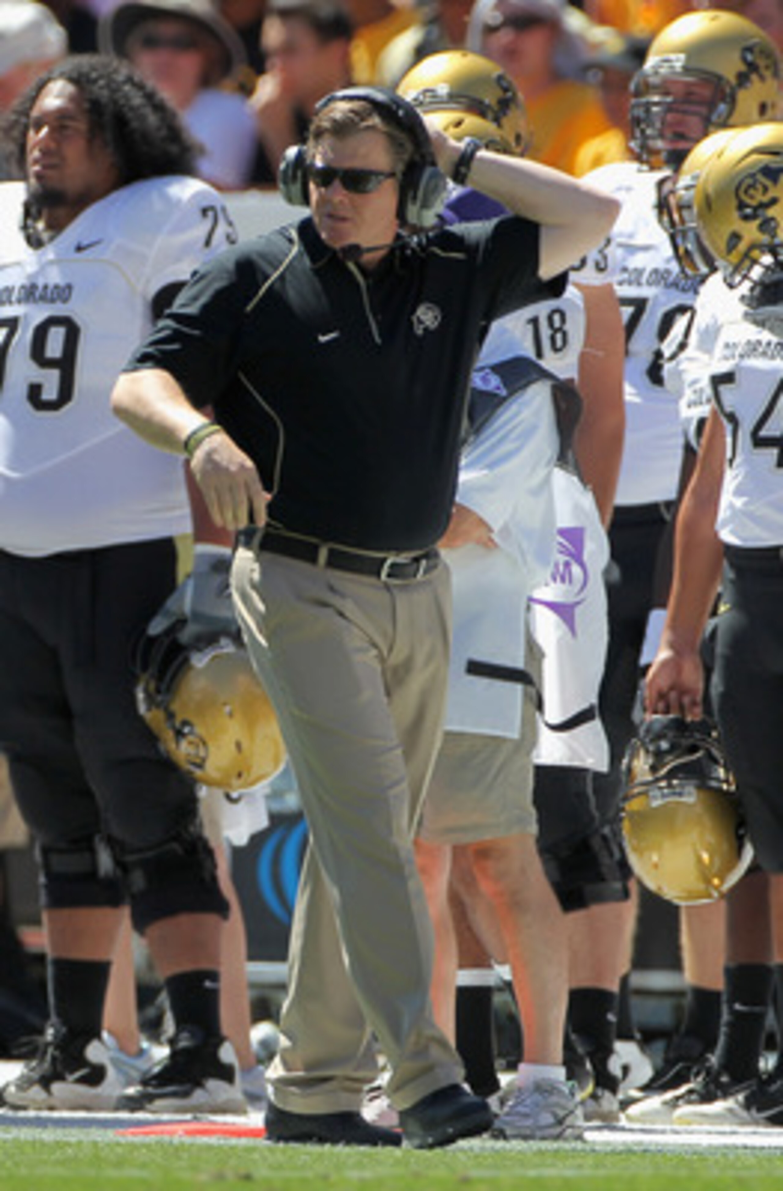 DENVER - SEPTEMBER 04:  Head coach Dan Hawkins of the Colorado Buffaloes leads his team against the Colorado State Rams in the Rocky Mountain Showdown at INVESCO Field at Mile High on September 4, 2010 in Denver, Colorado. Colorado was awarded the Centeni