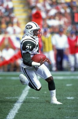 3 Sep 2000:  Aaron Glenn #31 of the New York Jets runs with the ball during the game against the Green Bay Packers at Lambeau Field in Green Bay, Wisconsin. The Jets defeated Packers 20-16.Mandatory Credit: Tom Hauck  /Allsport
