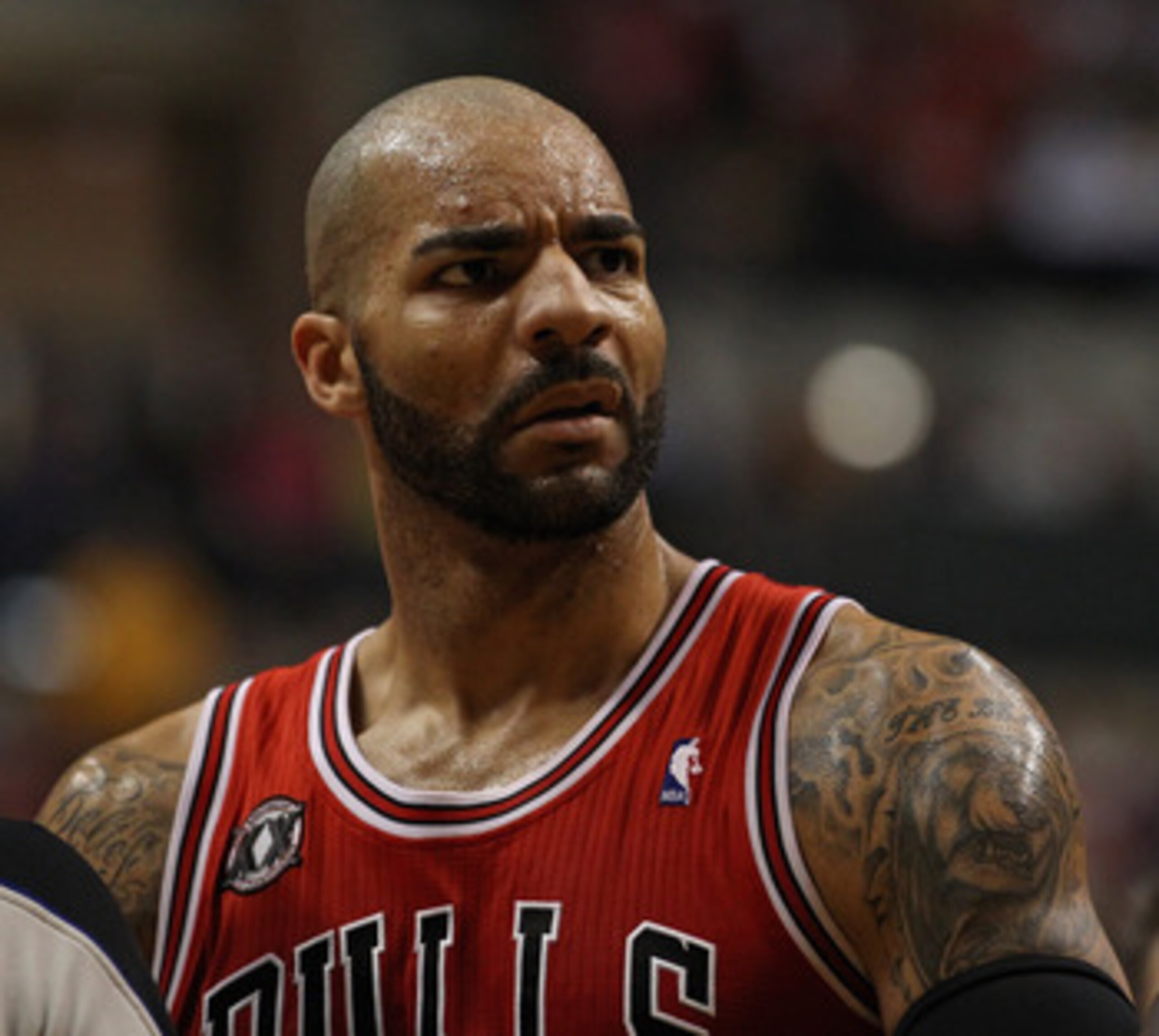 INDIANAPOLIS, IN - APRIL 23: Carlos Boozer #5 of the Chicago Bulls stares at Roy Hibbert of the Indiana Pacers in Game Four of the Eastern Conference Quarterfinals in the 2011 NBA Playoffs at Conseco Fieldhouse on April 23, 2011 in Indianapolis, Indiana. 