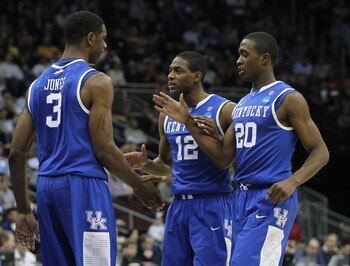 NEWARK, NJ - MARCH 27:  Terrence Jones #3 of the Kentucky Wildcats is congratulated by Brandon Knight #12, Doron Lamb #20 and DeAndre Liggins #34  during the first half of the game against the North Carolina Tar Heels in the east regional final of the 201