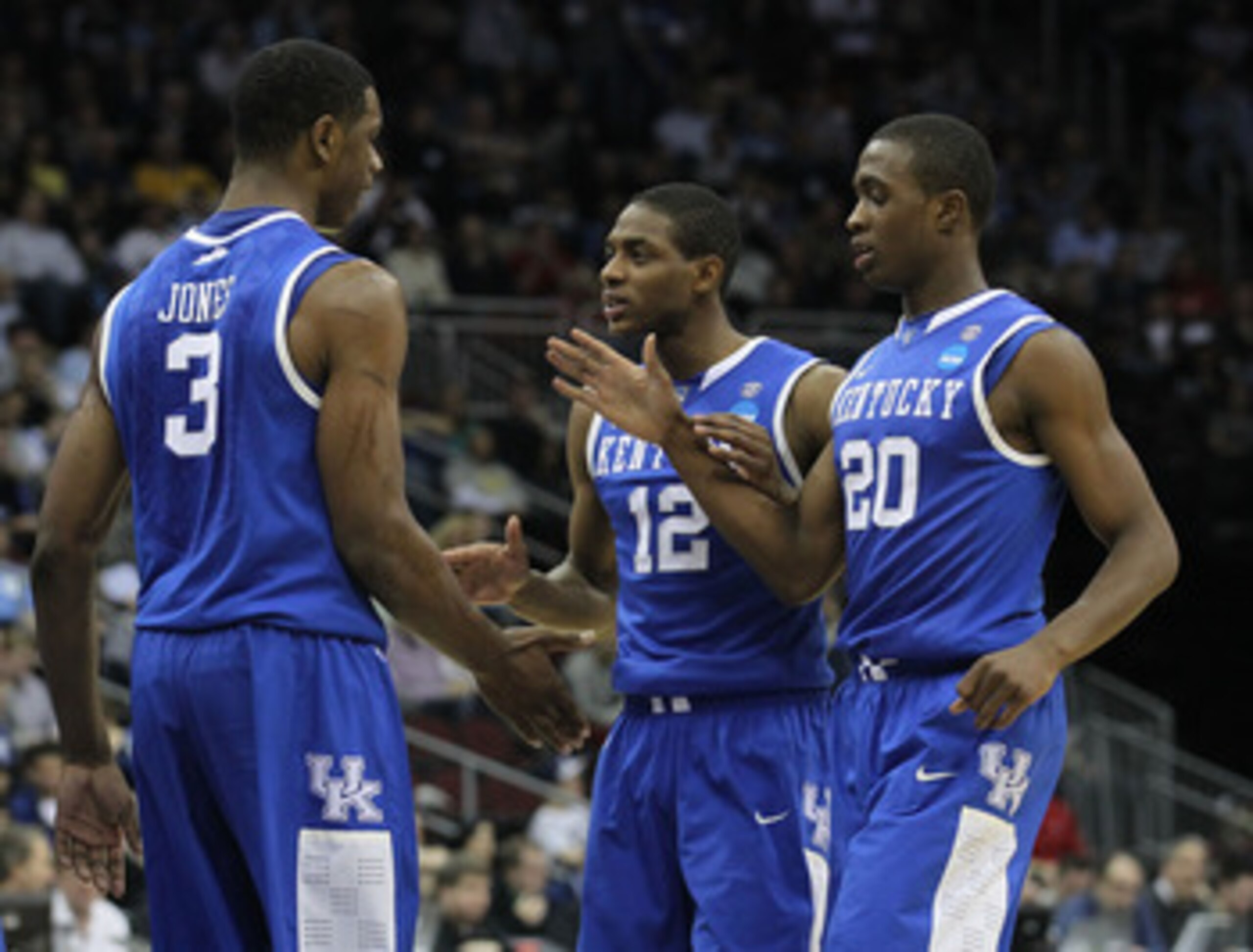 NEWARK, NJ - MARCH 27:  Terrence Jones #3 of the Kentucky Wildcats is congratulated by Brandon Knight #12, Doron Lamb #20 and DeAndre Liggins #34  during the first half of the game against the North Carolina Tar Heels in the east regional final of the 201