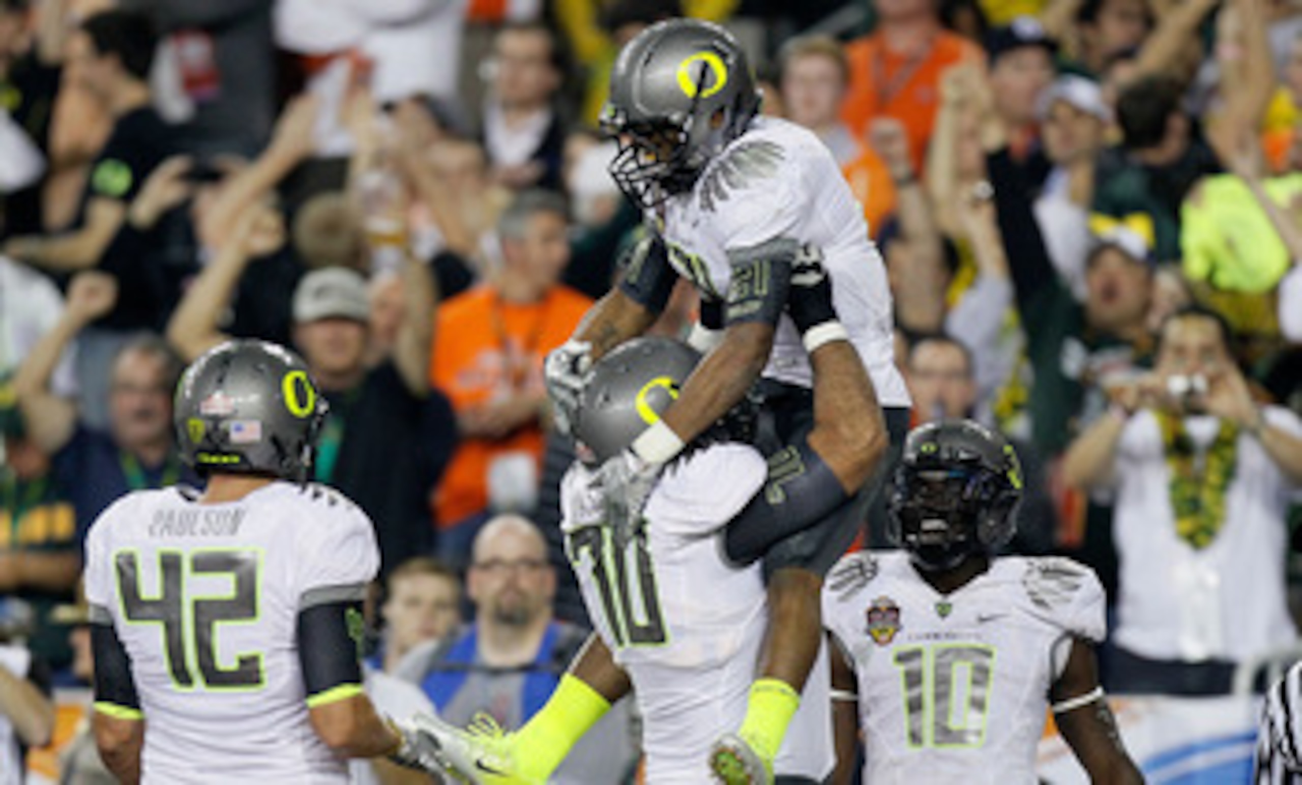 GLENDALE, AZ - JANUARY 10:  (R-L) LaMichael James #21 and Ramsen Golpashin #70 of the Oregon Ducks celebrate James' eight-yard touchdown reception in the second quarter against the Auburn Tigers during the Tostitos BCS National Championship Game at Univer