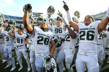 STATE COLLEGE, PA - NOVEMBER 27:  Linebacker Denicos Allen #28 and teammates celebrate their Big Ten championship after a game against the Penn State Nittany Lions on November 27, 2010 at Beaver Stadium in State College, Pennsylvania. The Spartans won 28-