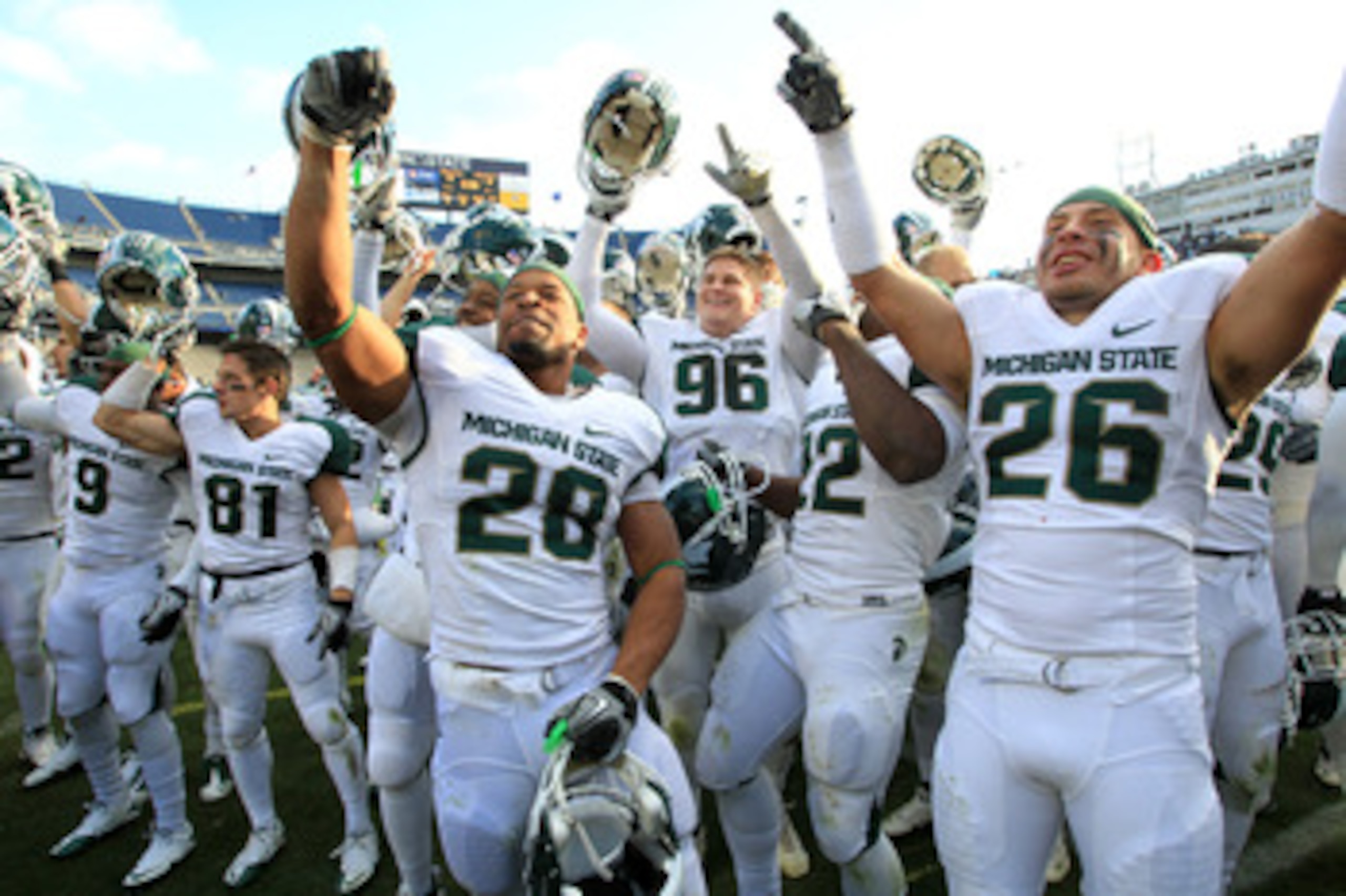 STATE COLLEGE, PA - NOVEMBER 27:  Linebacker Denicos Allen #28 and teammates celebrate their Big Ten championship after a game against the Penn State Nittany Lions on November 27, 2010 at Beaver Stadium in State College, Pennsylvania. The Spartans won 28-