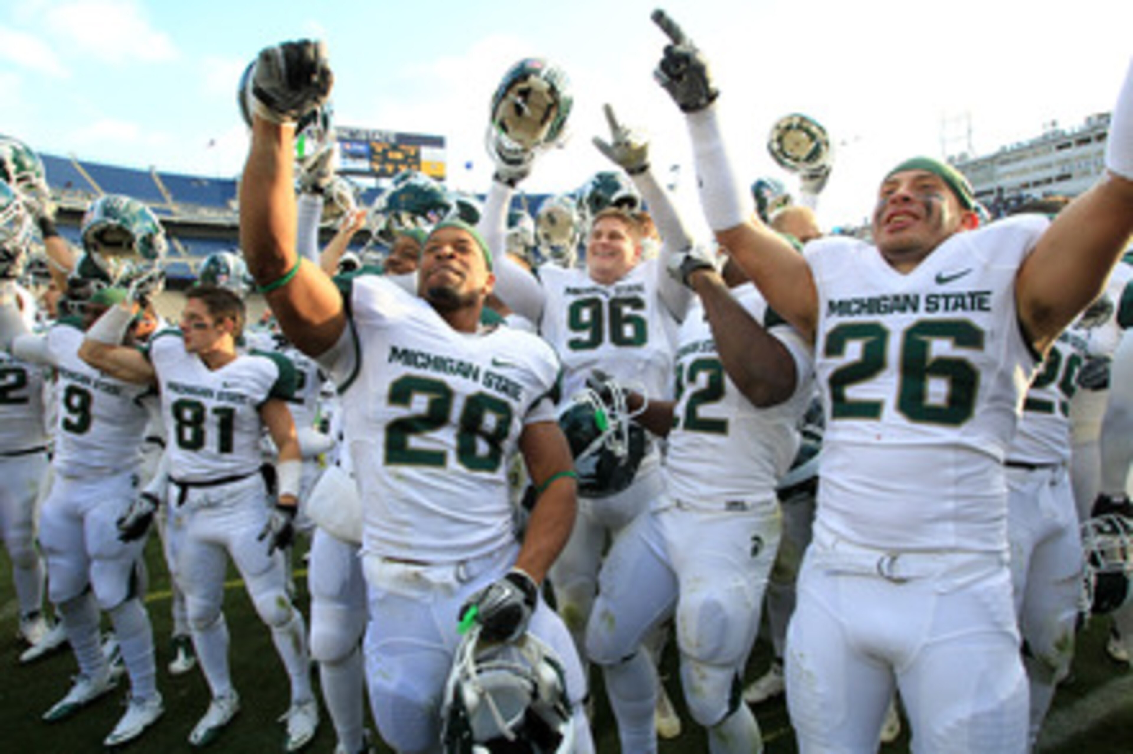 STATE COLLEGE, PA - NOVEMBER 27:  Linebacker Denicos Allen #28 and teammates celebrate their Big Ten championship after a game against the Penn State Nittany Lions on November 27, 2010 at Beaver Stadium in State College, Pennsylvania. The Spartans won 28-