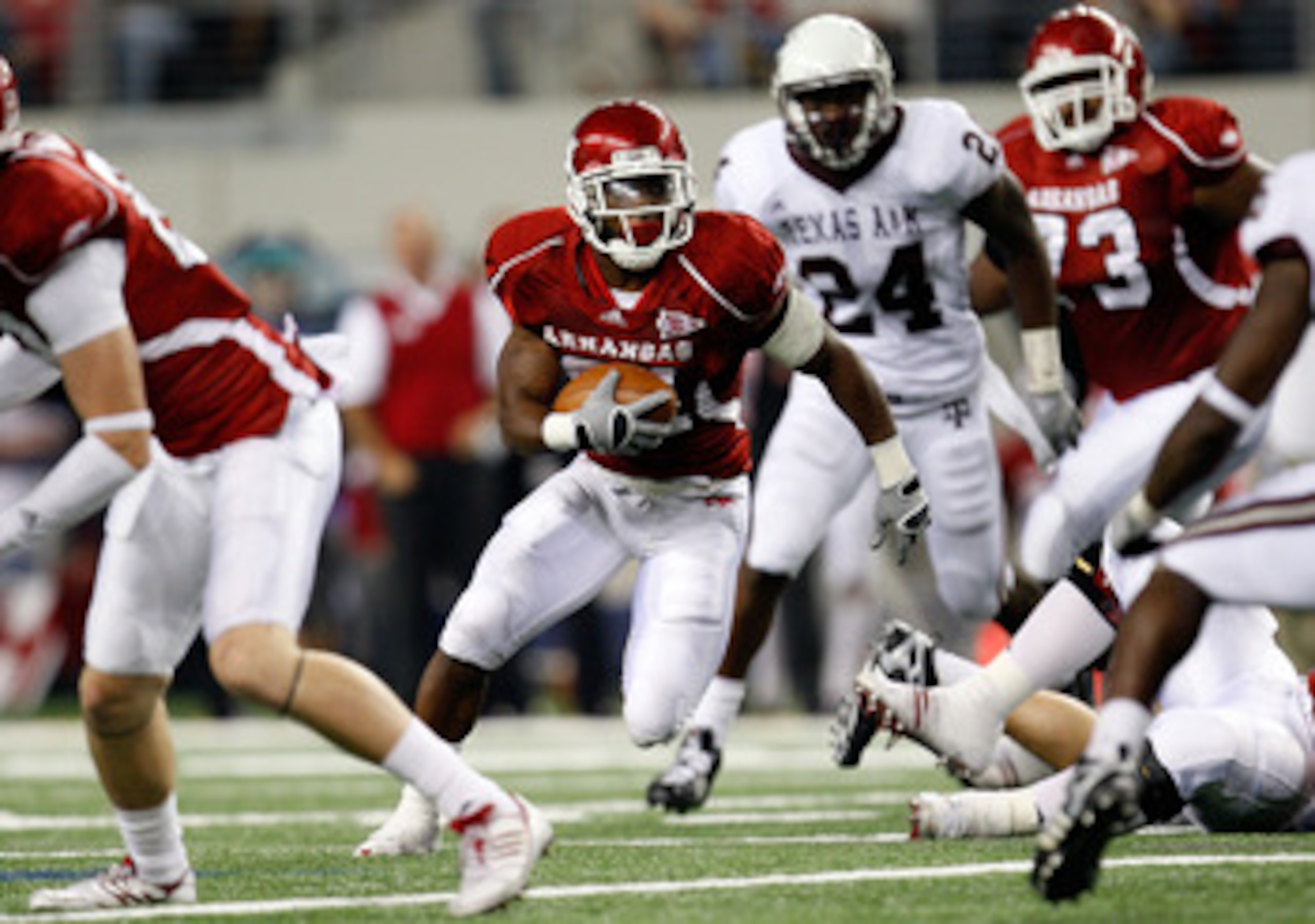 ARLINGTON, TX - OCTOBER 03:  Running back Michael Smith #21 of the Arkansas Razorbacks runs against the Texas A&M Aggies at Cowboys Stadium on October 3, 2009 in Arlington, Texas.  (Photo by Ronald Martinez/Getty Images)