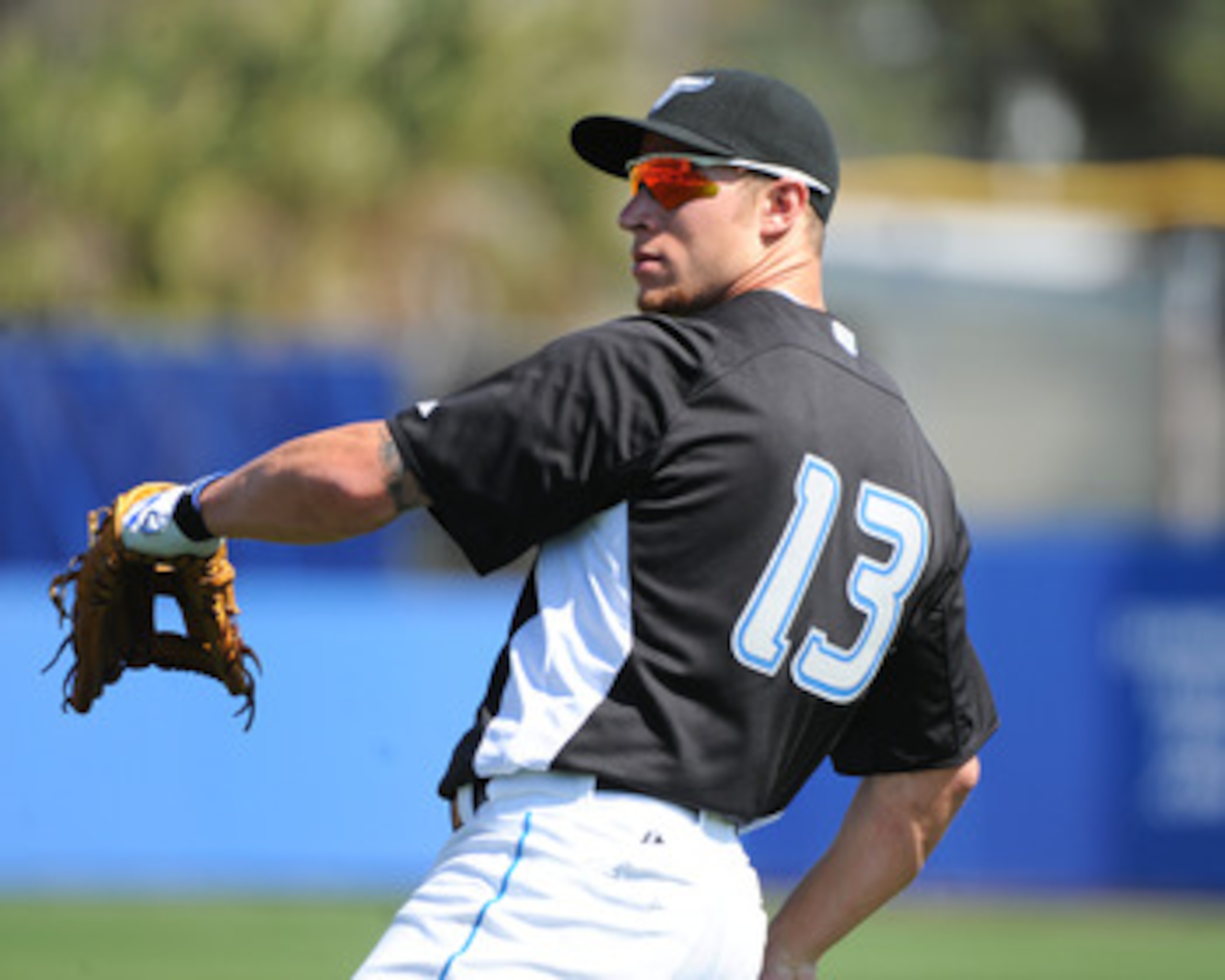 DUNEDIN, FL - FEBRUARY 26:  Infielder Brett Lawrie #13 of the Toronto Blue Jays warms up for play against the Detroit Tigers February 26, 2011 at Florida Auto Exchange Stadium in Dunedin, Florida.  (Photo by Al Messerschmidt/Getty Images)