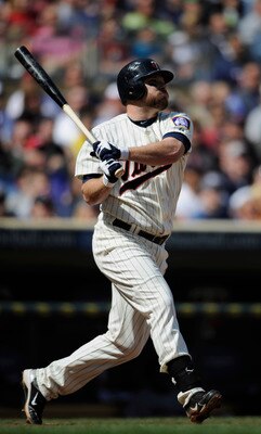 MINNEAPOLIS, MN - APRIL 24: Jason Kubel #16 of the Minnesota Twins hits a two-run double against the Cleveland Indians during the seventh inning of their game on April 24, 2011 at Target Field in Minneapolis, Minnesota. Twins defeated the Indians 4-3. (Ph